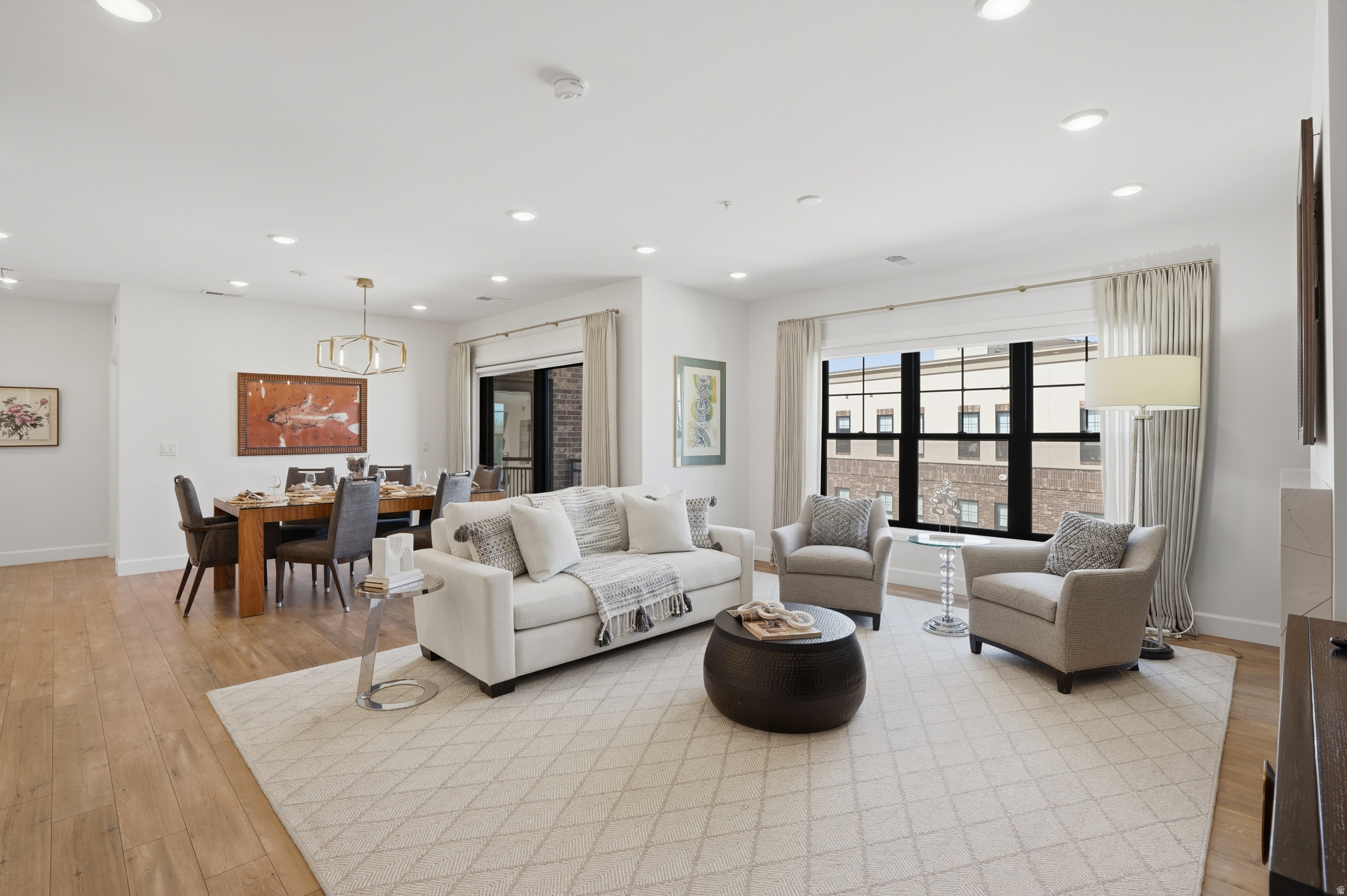 Welcome to this three bedroom top floor luxury home at the Station Condominiums in the heart of downtown Holladay. This open floor plan has beautiful natural light in every room, secure underground climate-controlled parking, elevator and ample storage. This maintenance free lifestyle, secure building is located right in the heart of the Holladay City Village where a short walk gets you to many amenities including dining, shopping, grocery stores, food trucks, coffee shops, bakeries, post office, and entertainment. Enjoy the spectacular rooftop patio, complete with a fire pit, BBQ, gazebo, and lounge area and marvel in the 360 degree views of the mountains and Salt Lake Valley. Located just 20 minutes from the airport, 30 minutes to Alta ski resort and 40 minutes to Park City.