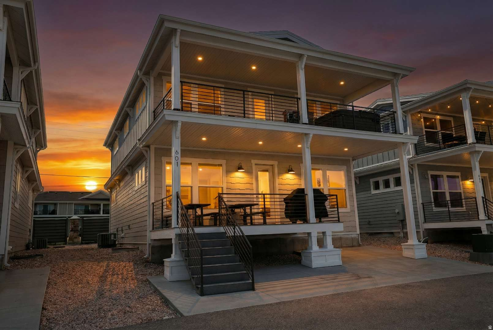 Experience lakefront living at its finest at Legacy Beach Lookout, a stunning home located in the sought-after Legacy Beach Resort in Garden City. Perfectly positioned just a short walk from the shoreline of Bear Lake, this beautifully designed 6-bedroom, 6-bathroom retreat offers exceptional comfort, space, and views. Sleeping up to 22 in beds with a maximum occupancy of 24, the home features three luxurious master suites and high-end mattresses throughout, making it ideal for large gatherings or vacation rentals.  Take in breathtaking lake views from your private patio, complete with your own hot tub-perfect for enjoying peaceful sunrises over Bear Lake. Inside, the thoughtfully designed floor plan caters to both relaxation and entertaining. The main level features a spacious open-concept living room and kitchen, ideal for hosting, along with a bedroom and 1.5 bathrooms, including a main-level master suite with a king bed and private bath.  Upstairs, you'll find three additional bedrooms, including a king suite with a private bathroom and lake views, along with two well-appointed rooms each featuring a queen bed and twin bunk. A deck on this level offers a perfect place to unwind and take in the scenery. The lower level is designed for fun and entertainment, with a large family room, arcade games, and two more bedrooms-one set up with two bunk beds and a queen, and the other with a queen bed and twin bunk, making it a perfect space for kids or extra guests.  Legacy Beach Resort amenities include a clubhouse, fitness center, swimming pool, and hot tub, all just a short walk away. Whether you're looking for a private getaway or a high-performing rental property, this lakefront home offers the best of Bear Lake living.