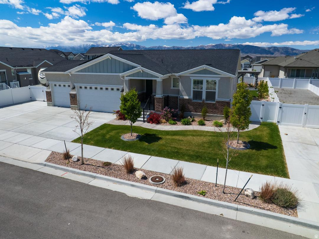 SELLER WILLING TO CONCEDE $5000 TOWARD BUYER CLOSING COSTS! This beautiful craftsman in a quiet family oriented neighborhood is priced to sell and offers a large 3 car garage with lots of storage and epoxy floors. The kitchen has a large island, pullouts in all of the lower cabinets. Adjacent to the kitchen is a good size dining area and the nice great room which has a custom electric fireplace flanked by large ceiling height cabinets and the rare 8' doors and 9' ceilings throughout make the home very airy. All windows throughout the house have beautiful (no warp) plantation shutters. The fully finished basement with 3 additional bedrooms and a spacious full bathroom including double sinks provides a retreat for everyone. There is a must see custom wet bar with lots of cabinets and a live wood bar and concrete countertop. Entertain your family and friends in the large game area which is surround sound ready for you and your family to enjoy movie night and there's plenty of room for either air hockey, a pool table, a ping pong table or foosball in addition there's a roomy cold storage area. Step into the large backyard  where you can entertain your family and friends on the large trex deck (16' x 25') and off in the far corner of the yard is a beautiful pergola over the large concrete pad equipped with a spa ready 220 volt outlet. Store your garden tools in the spacious 8' x 12' outdoor shed. Store all of your toys on the large RV pad (15' x 75'). The perimeter Jellyfish programmable lighting to reflect any holiday and the colored LEDs in the backyard planters make for a nice effect while gazing at the stars in the backyard. You will definitely save money with $10-$15 monthly electric bills with the fully owned solar system including a 10 KW battery. Don't miss this opportunity to buy this most excellent home! Call to setup a viewing today!