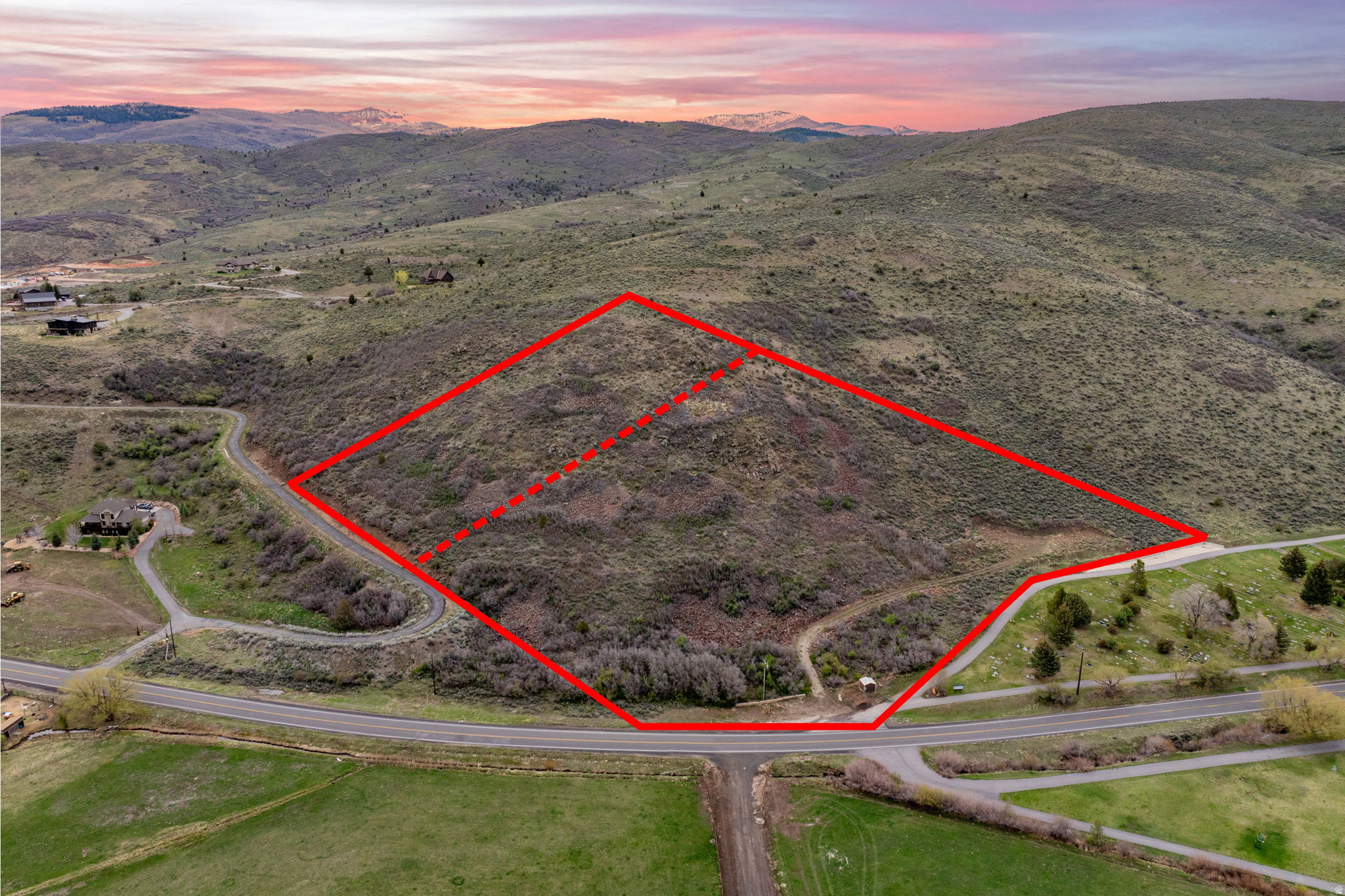 You won't believe these views! And this lot has been developed and is ready to build on. Perched on a private hillside above the valley, this remarkable 11-acre, permit-ready parcel delivers sweeping panoramas that reach across the entire valley floor. The privacy here is unmatched, tucked above a cemetery with no neighbors crowding your sight-lines or your lifestyle. And the hard work is already done: the site plan has been approved, the road and building envelope are cut, a well has been drilled with a pump in place, and the septic and SWPP plans are approved. This lot is truly shovel-ready. Build your Dream Home or a private mountain sanctuary without the headaches of early-stage prep. (See attached documents.) No HOA means you design and use the land your way - an Additional 1,000 SF Accessory Dwelling Unit is also allowed. The property is zoned, in part, residential, agricultural, and recreational. Thus a conditional use permit for glamping sites may be possible. Outdoor enthusiasts will love the proximity to the Uinta National Forest, world-class fishing on the Provo River, and year-round recreation just outside your doorstep. Only 38 miles to Salt Lake City, 15 miles to Park City or Heber, and 8 miles to Jordanelle Reservoir. And did we mention the killer views? Come experience Privacy AND Proximity on this extraordinary home site - where you can create generational memories. Acreage information per survey. Buyer and Buyer's Agent to verify all.