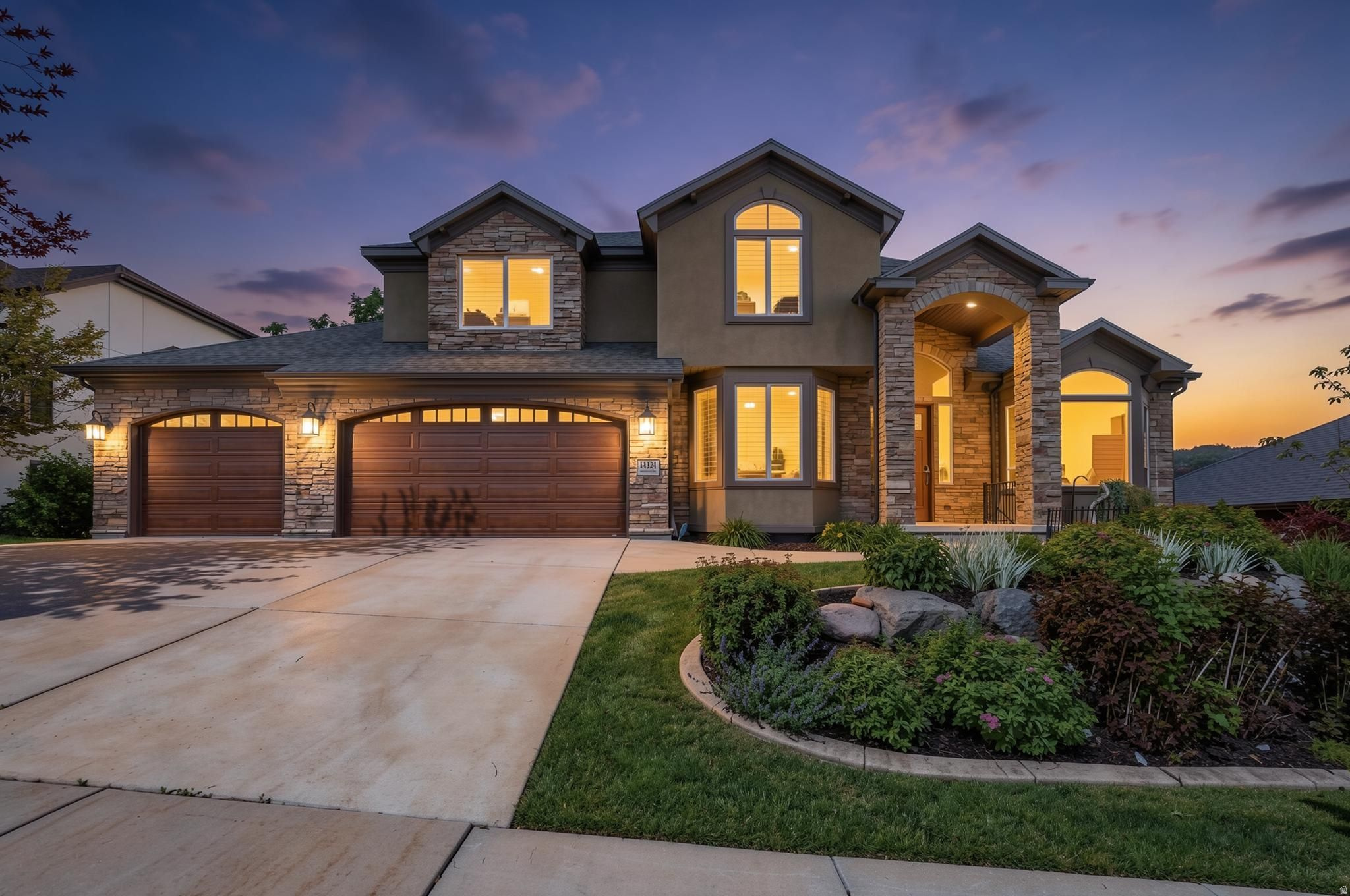 Located in one of Draper's most coveted east bench neighborhoods, this home was thoughtfully designed to take advantage of panoramic Salt Lake Valley views, golf course views from the primary suite, and a setting with no rear neighbors. The main level is designed for both everyday living and entertaining, featuring a remodeled kitchen with quartz countertops, a center island, double ovens, and gas stove. The kitchen opens to a spacious family room with custom wood built-ins and a gas fireplace, while a covered composite deck extends the living space outdoors and creates a natural gathering space for dining, entertaining, or simply enjoying the views. A dedicated office with custom built-ins offers a quiet and functional work-from-home space. The dramatic two-story foyer is anchored by an eye-catching Restoration Hardware chandelier, while soaring ceilings, plantation shutters, and expansive windows fill the home with natural light. Upstairs, the primary suite enjoys views of both the Salt Lake Valley and the neighboring golf course and features two walk-in closets with built-in organizers, a jetted tub, and separate shower. Three additional bedrooms, a full bathroom, and a conveniently located laundry room complete the upper level. The fully finished walkout basement provides exceptional flexibility with two additional bedrooms, a full bathroom, kitchenette, dedicated theater room with projector, screen, and built-in speakers, plus extensive storage including cold storage, a separate storage room, and under-stair space. Outside, mature trees, professional landscaping, a fully fenced yard, newly installed sod, and water features in both the front and back yards create a private outdoor setting. The oversized three-car garage includes a Gladiator wall organization system and additional built-in storage that will remain with the home. Additional features include three gas fireplaces, Nest thermostats, a three-zone HVAC system with three furnaces and three air conditioning units, and two 50-gallon water heaters. Located within excellent Draper school boundaries--Oak Hollow Elementary, Draper Park Middle School, and Corner Canyon High School-- and just minutes from hiking and biking trails, golf, parks, shopping, dining, and Silicon Slopes, this home combines thoughtful updates, generous living spaces, and an exceptional location. Square footage figures are provided as a courtesy estimate only and were obtained from county records .  Buyer is advised to obtain an independent measurement.