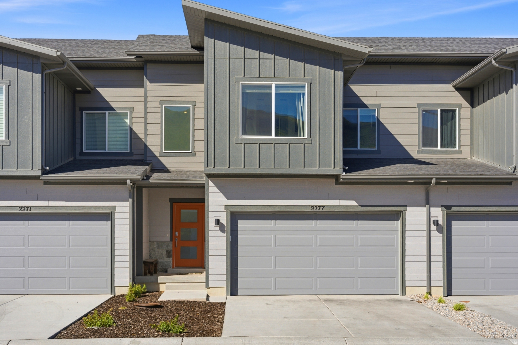 Experience easy mountain living at Jordanelle Ridge. This welcoming neighborhood enjoys in an abundance of green space, while residents have access to miles of hiking and biking trails right outside the front door. Take in stunning views of Deer Creek Reservoir and majestic Mount Timpanogos while experiencing the convenience of being just minutes from Deer Valley East Village, Midway, and Heber City's charming Main Street. This beautifully designed townhome in the heart of Heber City is a smart, contemporary floorplan designed with easy livability and maintenance. Thoughtfully finished with quality upgrades throughout, the home features beam accents, quartz countertops, stainless steel appliances, fashionable contemporary lighting throughout and a warm, inviting aesthetic that blends both style and comfort. The open-concept main level is filled with natural light and takes full advantage of the surrounding mountain views and open space, creating a peaceful setting to relax and unwind and savor the Wasatch mountains lifestyle. Upstairs, you'll find the generous primary suite and an additional two comfortable bedrooms and the living spaces are well-appointed.  The beautifully finished walkout lower level adds valuable flexibility with a spacious gathering area, dedicated office, and a 3/4 bath--ideal for working from home, hosting guests, or creating additional recreation space. A spacious 2-car garage provides plenty of room for vehicles, outdoor gear, and storage. Whether you're looking for a full-time residence, long term rental opportunity, a gorgeous mountain retreat, or an investment opportunity, this home offers an exceptional combination of location, lifestyle, and year-round recreation.