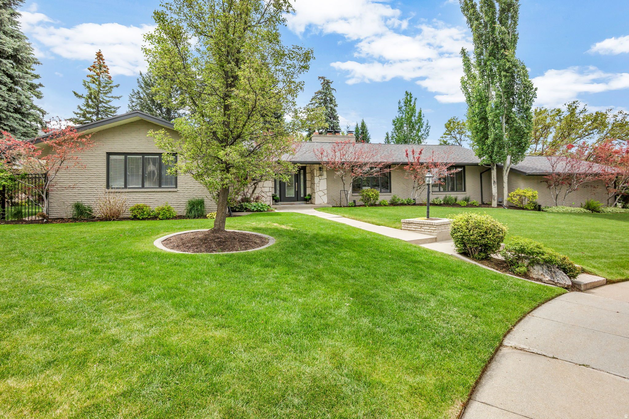 Wow!!!  This is a home you have to see in person to fully appreciate.  It is gorgeous inside and out!!!  It has been fully remodeled and is perfect for entertaining and comfortable living.   It is located in a sought-after neighborhood in Bountiful with top notch schools, easy access to shopping and restaurants and a quick commute to Salt Lake.  The light and bright open spaces feel so welcoming, and the beautifully landscaped private yard provides a perfect serene retreat.  There are too many features to list but some of the upgrades include:  New roof 2026, new furnaces and AC 2025, new water heaters and water softener 2023, entire basement recarpeted 2023.  In 2024 it had brand new hardwood floors and new carpet throughout the entire main floor, new paint, new cabinet hardware (on the previously updated cabinets), new upscale light fixtures, full renovation of both main floor bathrooms including a spa like primary bath with stunning tile around the wet room with a free standing tub and shower as well as 2 separate vanities.   You will also love the ample sized bedrooms and home office with beautiful custom built ins.   This one will not disappoint!