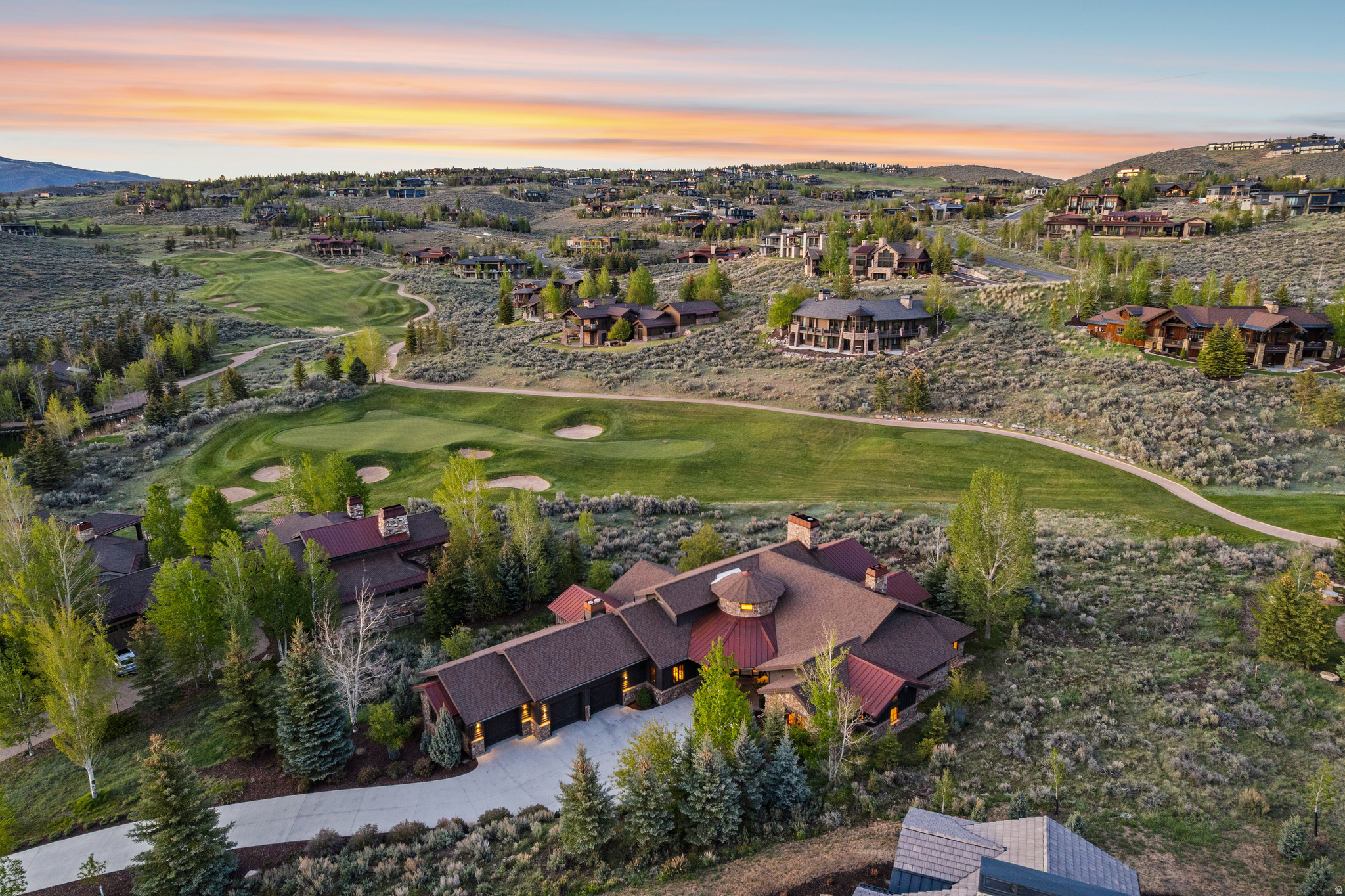 Refined Luxury in this Meticulously Designed Rare Single-Level Retreat with Sweeping Views      Located in Promontory's West View subdivision, 2723 E Bitter Brush Drive offers rare primarily single-level living in one of Park City's most sought-after gated communities. Designed for effortless living and refined entertaining, the open-concept floor plan is anchored by a chef's kitchen with high-end Viking appliances, custom finishes, and seamless flow into expansive living and dining areas.  Walls of windows bring in natural light and frame mountain, valley, and golf course views, creating a bright and inviting atmosphere throughout. The spacious primary suite provides a luxurious private retreat with a spa-like feel. There are two additional bedrooms connected by a Jack-and-Jill bath and a privately situated guest suite with 3/4 bath.  Extensive upgrades elevate the home throughout, including engineered hardwood flooring in the bedrooms, designer lighting, and mechanical system improvements such as dual Lennox furnaces, new heat pumps, a tankless water heater, water purification and softening systems, and an automatic water shut-off system.  Outdoor living spaces take full advantage of the setting with multiple areas to relax and entertain while enjoying the views and privacy. Additional highlights include a heated driveway, upgraded irrigation, and a three-car garage with epoxy flooring, custom cabinetry, and a garage heater.  This turnkey Promontory residence combines single-level convenience, high-end upgrades, and an exceptional location close to Park City's world-class amenities and ski resorts. Full Golf Membership is available.