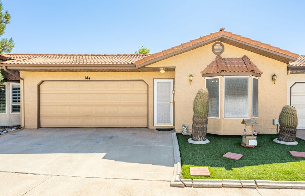 Welcome to Vista Ridge, a vibrant 55+ community! This well-maintained 2-bedroom, 2-bath home offers comfortable, low-maintenance living in a great St. George location. The open floor plan features a spacious living area, abundant natural light, and a functional kitchen with plenty of cabinet space and stainless steel appliances. The primary suite includes a private bath, while the second bedroom is ideal for guests or a home office. Enjoy the enclosed sunroom, private backyard with artificial turf, storage shed, and attached 2-car garage. HOA amenities include, indoor pool, clubhouse, spa, fitness center, library and multipurpose room. Conveniently located near shopping, dining, golf, medical facilities, and outdoor recreation, this home is the perfect full-time residence or seasonal getaway.
