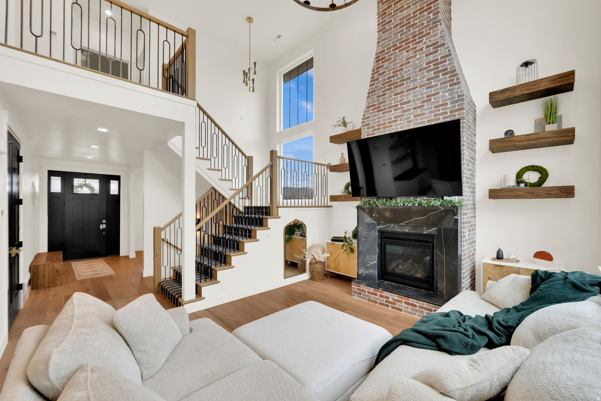 Exceptional craftsmanship in this exquisite custom residence overlooking Eagle Mountain Golf Course. From the grand staircase to the luxurious primary suite, every detail has been thoughtfully curated with elevated finishes throughout. Designer lighting, custom cabinetry, artisan tile work, rich hardwood flooring, a marble fireplace, 9-foot 3-car garage doors, and countless custom upgrades create a home of timeless elegance. Chefs dream kitchen is as functional as it is beautiful with oversized walk-in pantry featuring a dedicated chef's shelf with extra electrical outlets for small appliances. Beyond its stunning finishes, the home is equipped with a whole-home humidifier for enhanced year-round comfort and permanent all-season exterior lighting makes celebrating every holiday effortless while enhancing the home's curb appeal year-round. The fully finished basement offers exceptional versatility with a private entrance, spacious family room, two bedrooms, full bath, laundry, a dedicated putting room, an extra-large storage room, and plumbing already in place for a future kitchen-ideal for a future ADU or multigenerational living. Outdoors, the landscaped backyard provides the perfect setting for entertaining while offering a level of privacy rarely found on golf course properties. Nestled within a peaceful, well-maintained community, residents enjoy access to a neighborhood pool, pickleball and basketball courts. Conveniently located just minutes from shopping, Costco, and the newly expanded Mountain View Corridor, this exceptional home offers the perfect balance of luxury, convenience, and breathtaking views from nearly every window.