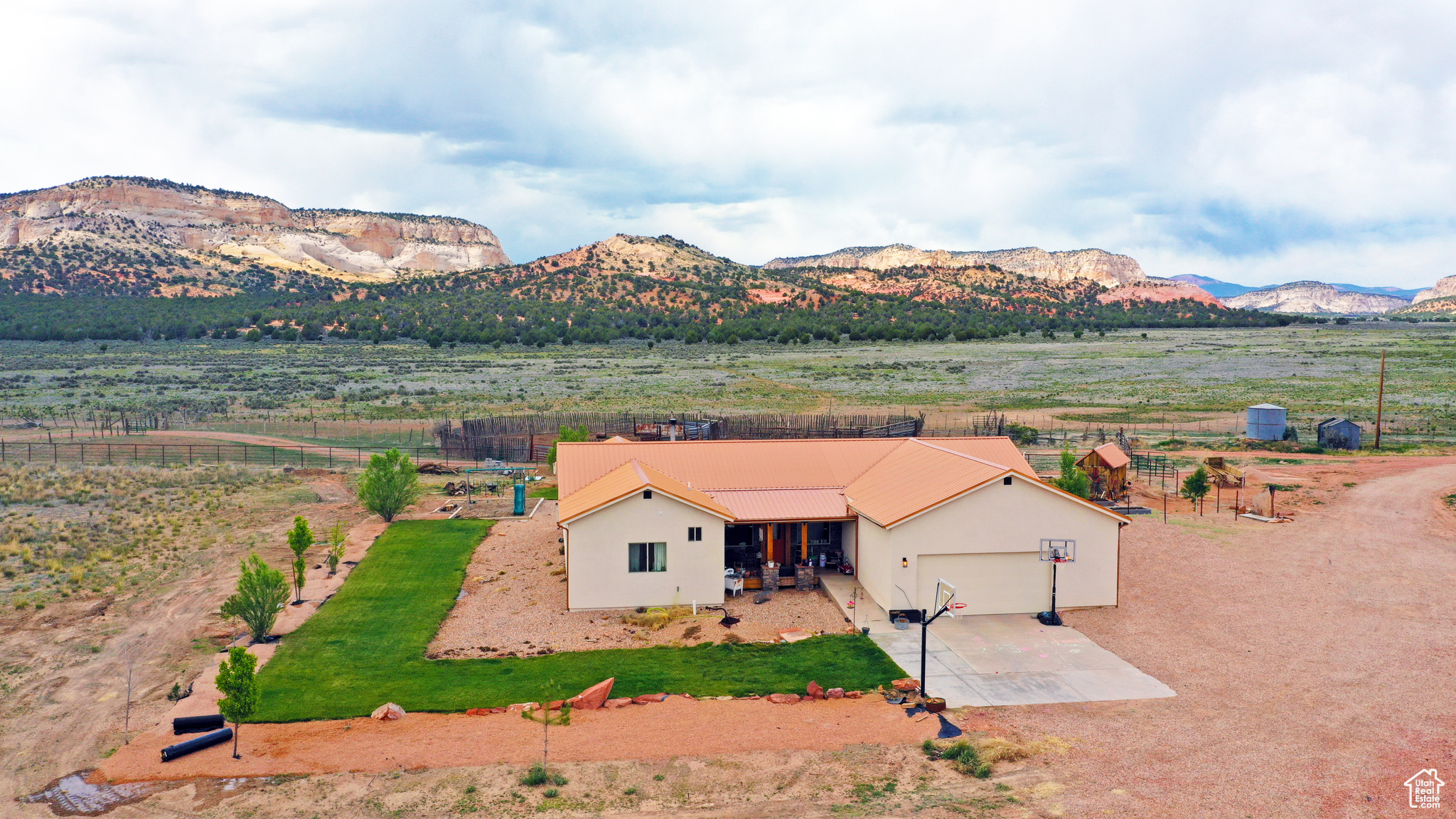Nestled at the mouth of breathtaking Johnson Canyon, this 4-bedroom, 3-bathroom ranch-style retreat offers the perfect fusion of serenity, functionality, and unparalleled access to Southern Utah's natural beauty. Sitting on 10 fully usable acres that back directly onto protected BLM land, you'll enjoy uninterrupted views of towering red cliffs and endless open skies-your private slice of the American West. Designed for those who crave space and versatility, the property includes a charming main residence with warm natural light, an open floor plan, and sweeping canyon views; a well-equipped horse barn; a massive detached workshop perfect for storage, hobbies, or business operations; and an income-generating ADU (accessory dwelling unit) ideal for guests, rental income, or multi-generational living. Whether you're starting your dream homestead, launching a short-term rental business, or simply escaping the hustle, this property checks every box. Located just minutes from downtown Kanab, you're in the epicenter of outdoor adventure, with Zion National Park 30 minutes away, Bryce Canyon under an hour, Lake Powell just over an hour, and the Grand Canyon North Rim a mere 90 minutes. Surrounded by world-class hiking, slot canyons, and wildlife refuges, Johnson Canyon offers the peace of remote living with the convenience of being within reach of Kanab's restaurants, shops, and services. Few properties offer this level of freedom, potential, and natural beauty in one package.