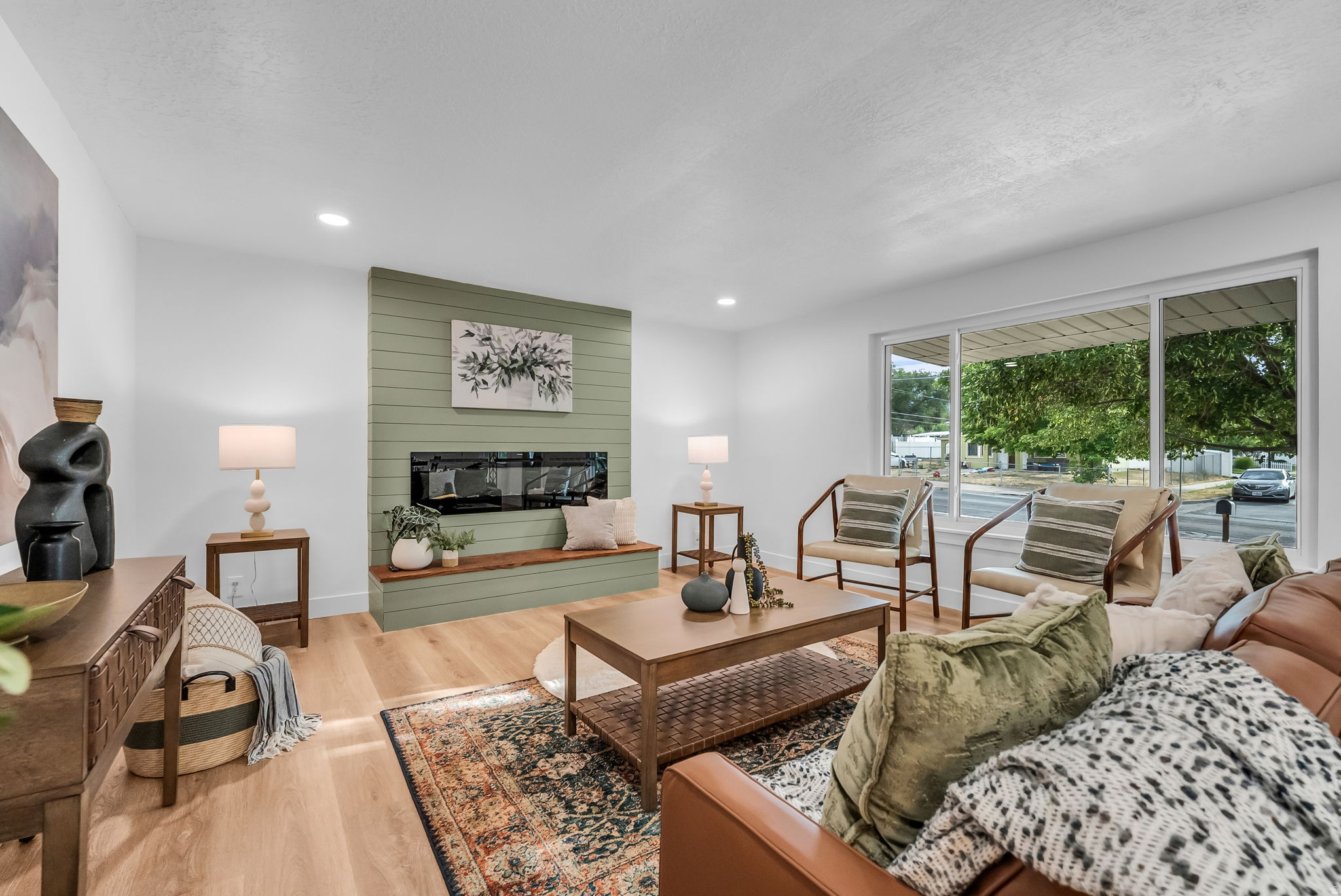 GRAND OPEN HOUSE THIS SATURDAY 7/25 11AM-2PM! Fully renovated and move-in ready, this home combines modern finishes with incredible flexibility. The standout feature is the complete basement mother-in-law apartment with its own private entrance, full kitchen, separate laundry, and two bedrooms-perfect for multigenerational living or potential rental income.  The detached two-car garage offers excellent parking and storage, while two additional sheds provide even more room for tools, hobbies, or seasonal items. Situated on a rare 0.29-acre lot, the spacious backyard is ready for your vision and outdoor lifestyle.  Conveniently located between Mountain View Corridor and Bangerter Highway, you'll enjoy quick access throughout the valley. Jackling Elementary is within walking distance, Hunter High School is just minutes away, with parks, shopping, and local favorites like the Cielito Lindo restaurant nearby.  Whether you're looking for extra living space, room for extended family, or a home with income potential, come and see how you would make this home yours.