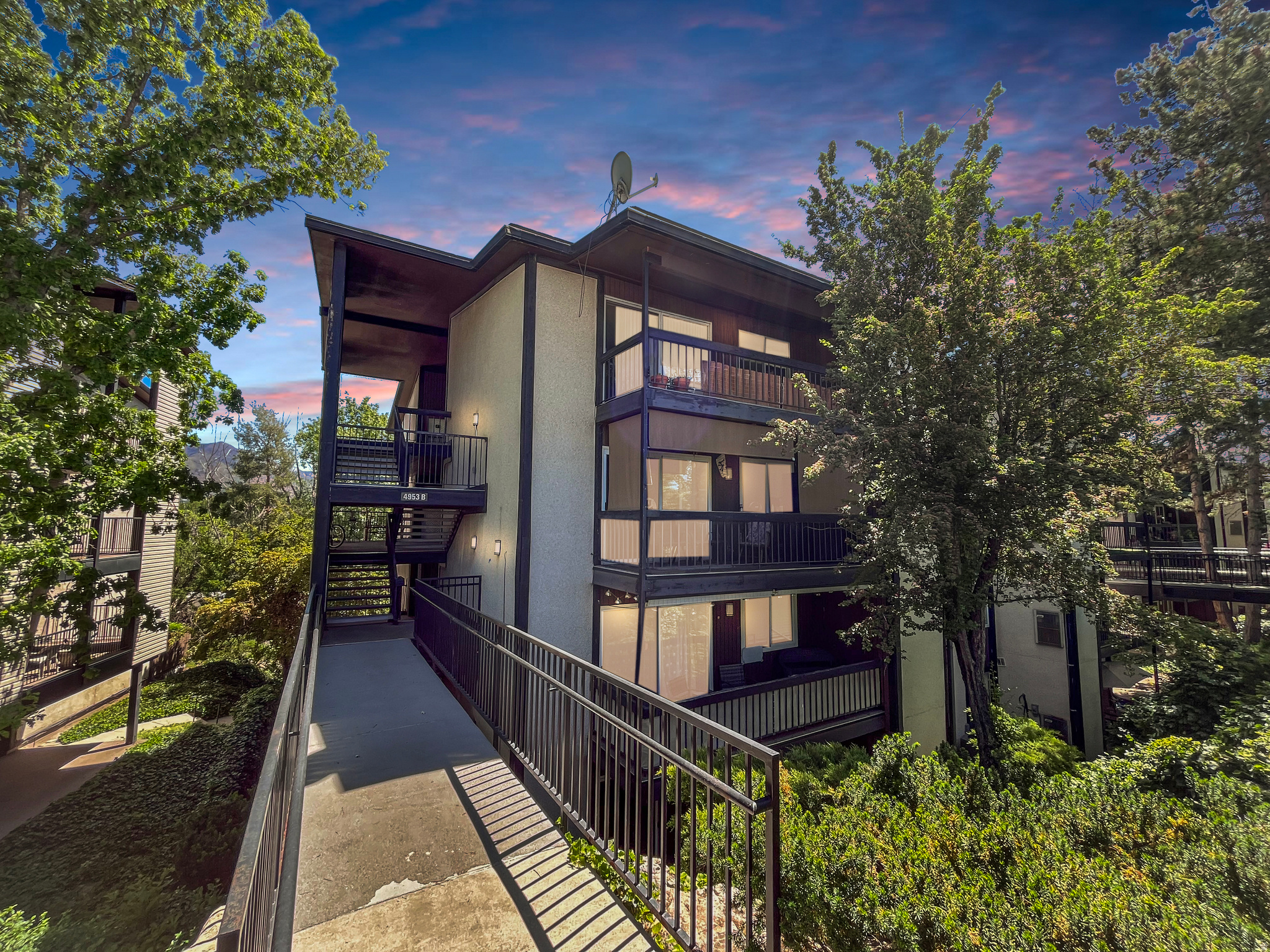 Beautifully renovated and turnkey, this stunning condo in the highly sought-after Three Fountains community combines comfort, style, and convenience. Updated throughout with quartz countertops, new stainless appliances, new lush carpet in the bedrooms and luxury laminate plank flooring, the home offers warm tones, and thoughtful finishes at every turn. The spacious living area opens to a large covered private patio offering an ideal spot to unwind in privacy. The building overlooks serene, wooded views, towering mountains, and a quiet flowing stream frequented by ducks and birds. The expansive primary suite features generous closet space, a sprawling double sink vanity, and a stunning glass-enclosed shower. A second updated bathroom showcases additional custom finishes. Included is your private laundry area offering additional storage space. A secure oversized storage room sits just below the unit, perfect for seasonal items and gear, and it is even climate controlled! Three Fountains residents enjoy access to well-kept amenities including a pool, tennis courts, walking paths, ponds, and beautifully landscaped grounds. Gas is included in the HOA payment, making one less utility to worry about. Ideally positioned between Murray and Holladay, the home is minutes from popular dining and shopping. A rare find in a beloved community-don't miss this stunning condo.