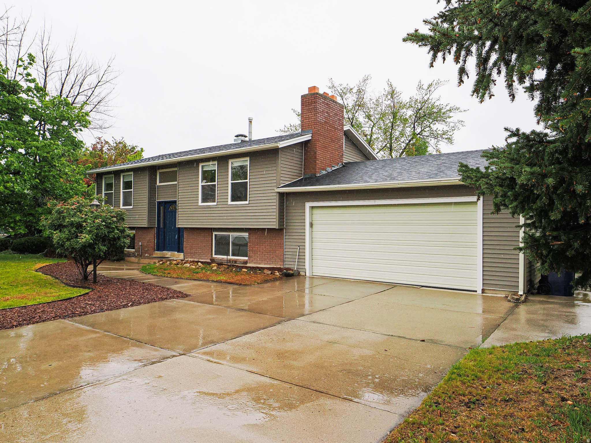Come experience this charming Sandy home nestled in a desirable, well-established neighborhood. This inviting 4-bedroom, 2-bath residence offers a functional and comfortable layout with welcoming living spaces and a fully finished basement, providing flexibility for everyday living and entertaining. The extra-long 2-car garage adds exceptional utility, featuring a built-in workbench and a 220V outlet-perfect for EV charging, welding, or powering high-demand tools. Outside, the expansive, usable lot creates endless possibilities for outdoor living, gardening, or hosting gatherings. Recent improvements, including central air conditioning and new windows throughout, enhance both comfort and energy efficiency. Ideally situated just minutes from shopping, dining, and everyday conveniences, with easy commuter access, this home offers the perfect balance of location and livability. A wonderful opportunity to own a well-maintained property in a fantastic area-don't miss it.