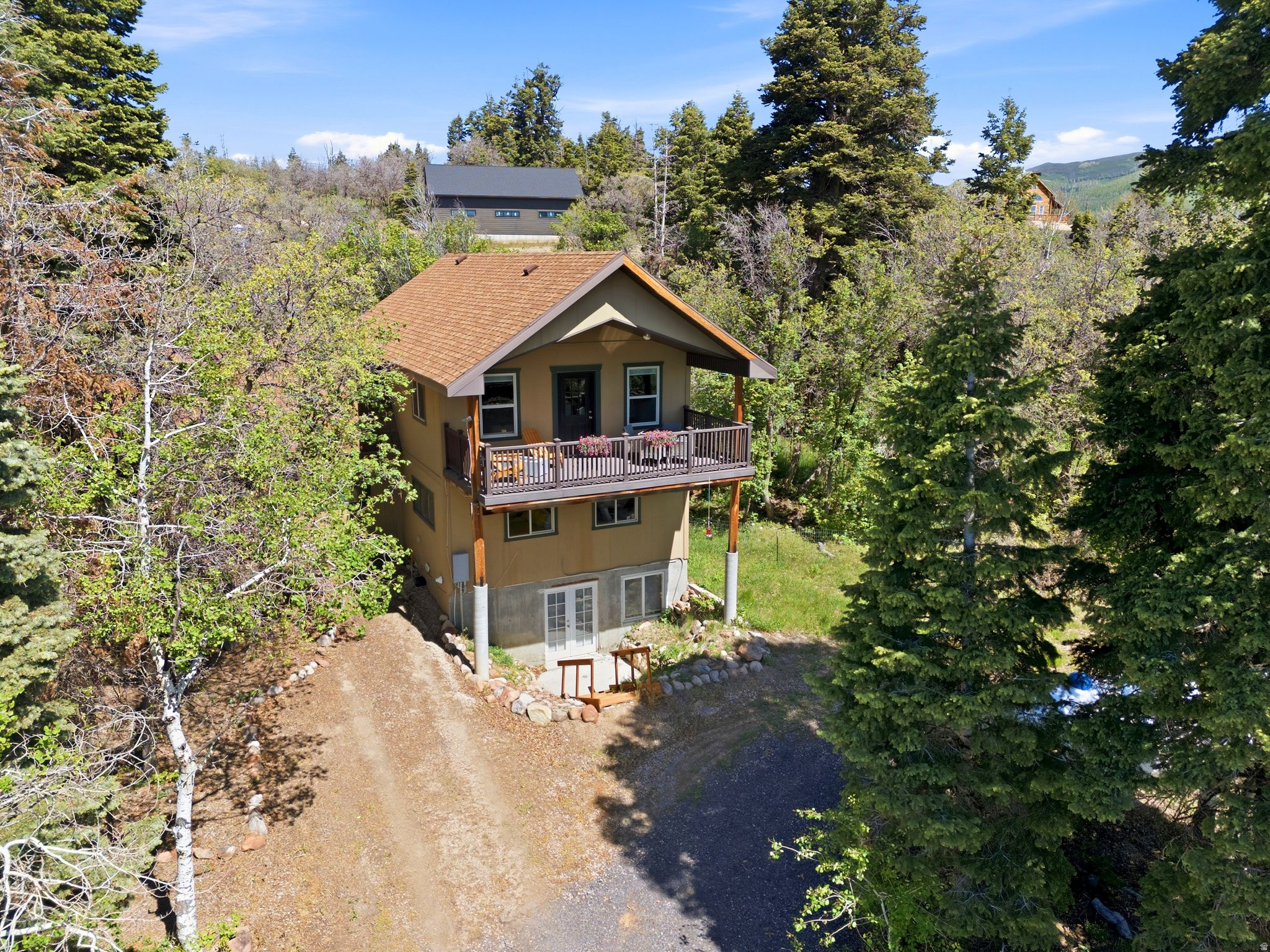 Escape the rush of everyday life and settle into the peace, clarity, and sparkling mountain air of your own private retreat. This home welcomes you with an eclectic blend of warmth, character, creativity and comfort-with an atmosphere that instantly feels like a true getaway. Just ten minutes east of Park City, with effortless access to Salt Lake City, this property offers the rare combination of convenience and complete seclusion. Surrounded by natural beauty, abundant wildlife, and quiet open space, it's a sanctuary where you can breathe deeply, slow down, and reconnect with the outdoors. Inside, the spacious master suite becomes its own haven, with sweeping views from every window and direct access to a generous deck overlooking the landscape. Curl up beside the electric fireplace after a long day or step out onto the front porch on summer evenings to watch deer graze just beyond your door. From your front steps, enjoy yearround recreation-hiking & biking, snowmobiling, crosscountry skiing, and snowshoeing across the ranch. Whether you're seeking a peaceful fulltime residence or a restorative weekend escape, this property delivers the privacy and tranquility so many crave. Opportunities like this are rare-don't let this mountain retreat pass you by. Home warranty