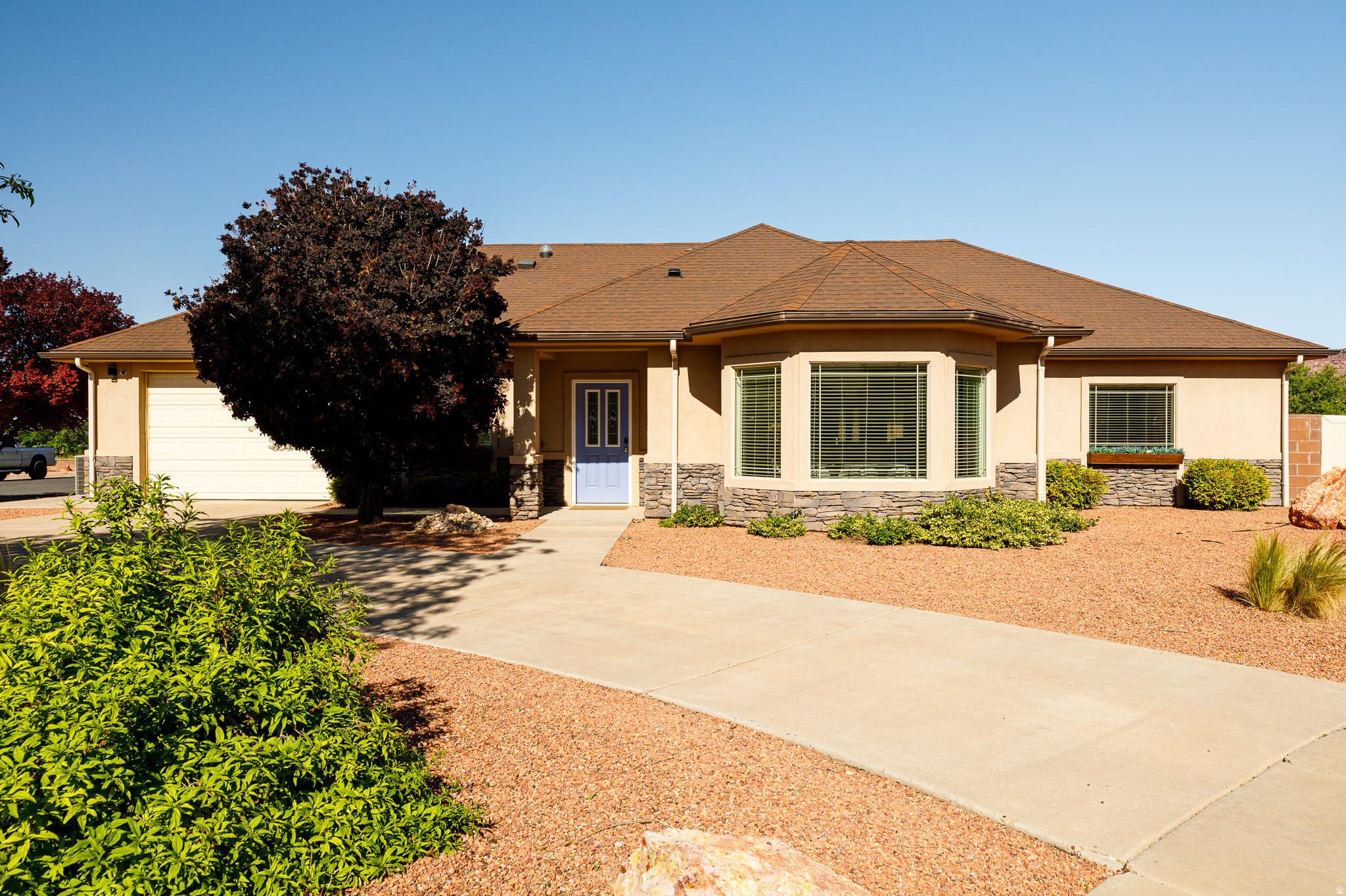 Discover the perfect blend of investment opportunity and Southern Utah lifestyle with this beautifully remodeled 3 bedroom, 2 bath home located right in Kanab! Currently operating as a successful short-term rental, this turnkey property is being offered fully furnished and ready to continue generating income from day one. Completely remodeled in 2022, this home shines with modern finishes and an inviting large open-concept living space featuring gorgeous LVP flooring and a spacious kitchen complete with gleaming quartz countertops, a large pantry, and a charming bay window dining area perfect for gathering after a day of adventure. The oversized primary retreat offers a relaxing escape. While the baths tile work, quartz finishes provide a spa-inspired feel. Two additional bedrooms are thoughtfully positioned on the opposite side of the home, providing comfort and privacy. The usable attached 2-car garage is being used as a heated and cooled game room with an epoxied floor, creating the ultimate entertainment space. Outside, unwind under the covered patio and soak in the hot tub while enjoying the peaceful setting. Has a lovely cul-de-sac lot location. Buyer to verify all details