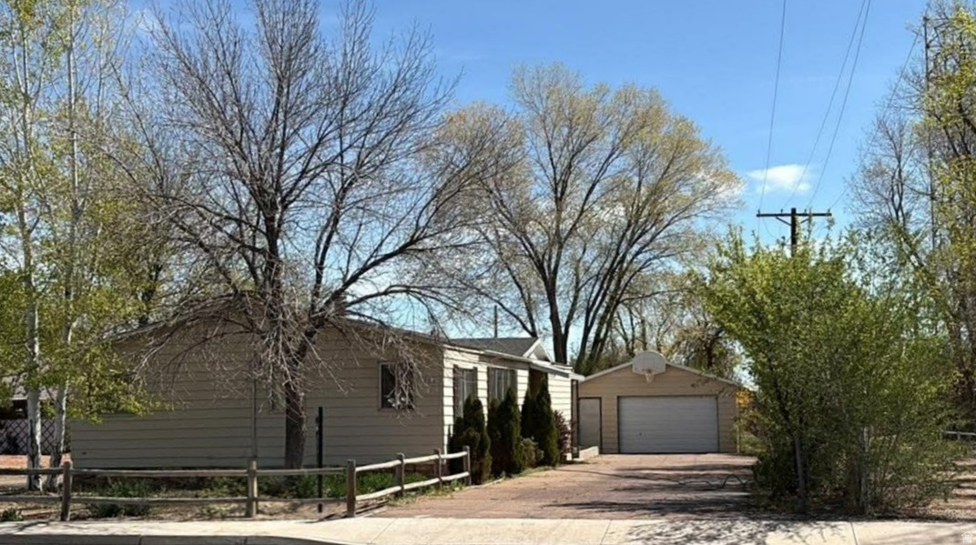 Awesome 3-bedroom, 2-bath home on a sprawling .39-acre lot. This home offers main-level living, so no trudging up and down stairs! The well-laid-out floor plan features both a separate living room and family room, providing plenty of space for entertaining, relaxing, or working from home. The kitchen has tons of cabinet space and even a double oven! The primary bedroom features a large closet and en suite bath. The huge lot offers tons of parking, a detached 2-car garage, and ample room to grow-perfect for additional storage, a shop, or outdoor living space.  The location can't be beat, close to health care facilities, schools and shopping! With its generous lot size and desirable location, this property would be a great fit for an investor or owner-occupant looking for room to grow, so SCHEDULE YOUR SHOWING TODAY!