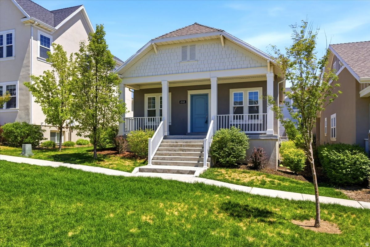 Welcome home to this beautiful, turn-key four-bedroom, three-full bathroom rambler. Step inside to a thoughtfully designed, space-maximizing layout offering the perfect blend of main-floor convenience, open entertaining spaces, and a fully finished, light-filled lower level.   Located in a sought-after Daybreak neighborhood, surrounded by multiple parks and scenic walking trails, this home sits just two blocks from Oquirrh Lake and its sandy beaches. To top it all off, the home overlooks an expansive green lawn with trees right out front. This beautifully manicured grassy paseo provides the perfect open park-like setting to relax and unwind, giving you all the outdoor benefits of a massive yard without any of the personal maintenance work.  Best of all, your monthly HOA fee covers high-speed fiber internet and gives you unlimited access to world-class community amenities. Enjoy five swimming pools, fitness centers, gym facilities, and resident boating privileges with free kayak and paddleboard rentals.  The kitchen comes fully equipped with premium stainless-steel appliances, including the refrigerator, and features a convenient pantry closet. The open living room is optimized for comfort and entertainment, featuring an included space-saving L-shaped sectional that fits perfectly, paired with a stunning 65-inch OLED TV mounted over the stairs with clean, in-wall 3-HDMI cable management. Retreat to the main-floor Primary Suite, complete with a private bathroom and a spacious walk-in closet. A second bedroom, an additional full bathroom, and a dedicated main-floor laundry hookup complete the seamless single-level footprint.  The lower level doubles your living space and is built for movie nights. The comfortable family room comes ready to entertain with an included TV setup featuring in-wall HDMI routing and a premium Dolby Atmos Soundbar and speaker system. The basement also hosts two additional bedrooms, a third full bathroom, a second laundry hookup, and two large storage rooms to keep your home perfectly organized.  The attached two-car garage features three heavy-duty overhead storage racks to keep your gear tidy. Location-wise, you are less than a mile from Harmons Grocery, Golden Fields Elementary, and Mountain Creek Middle School, making school drop-offs and grocery runs completely effortless. You are also less than a mile from Downtown Daybreak, where you can catch a movie or go bowling at the Megaplex District, or take a quick stroll to the new Bees Stadium to enjoy baseball games, community events, and free weekly summer concerts all season long.  Schedule your tour today!