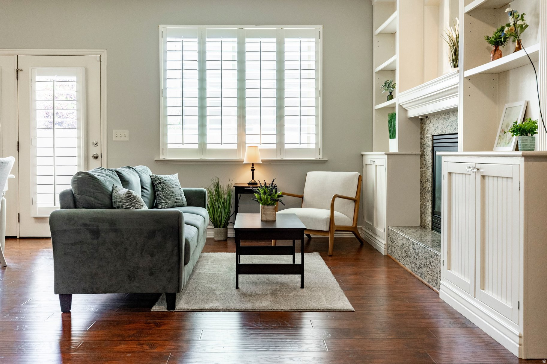 Welcome home to this beautifully maintained END-unit townhome in a desirable gated community that truly shows like a 10! Loaded with upgrades throughout, this home features a cozy fireplace, plantation shutters, two-tone paint, recessed lighting, and vaulted ceilings that create a bright, open feel. The kitchen is designed to impress with granite countertops, 42" knotty alder cabinets with crown molding, a gas stove, double oven and a fenced outdoor area. Built-in bookshelves, and a fun playroom tucked under the stairs add both charm and functionality. Every bedroom offers a walk-in closet, while the bathrooms feature matching granite finishes. Enjoy resort-style community amenities including a pool, clubhouse, playground, and more. Conveniently located directly across from Riverton High School with easy access to shopping, dining, and major commuter routes. This exceptional home offers comfort, style, and convenience all in one package. Don't miss your opportunity to make it yours before it's gone!