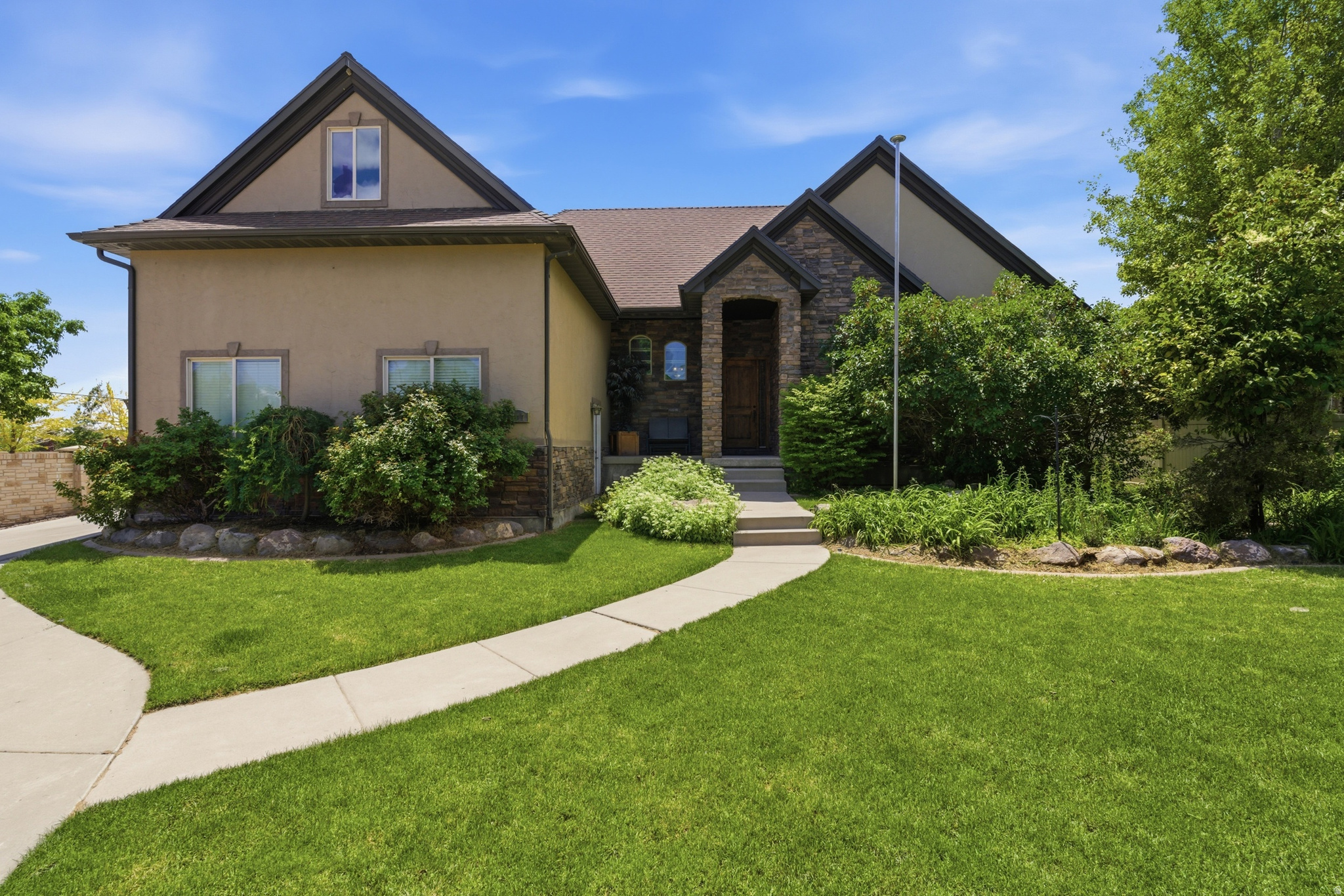 Beautiful home in prime Herriman location with a full mother-in-law basement apartment with a private entrance-perfect for multigenerational living, guests, or rental income potential. Seller is willing to contribute to buyer's closing costs for a rate buy down! Enjoy an incredible backyard designed for gathering and entertaining, with a large patio, fire pit, mature trees and grape vines, and garden beds that create an outdoor retreat. Inside, you'll find 5 bedrooms, 3 full bathrooms, 2 kitchens, a large loft space, 2 living rooms, and 2 laundry hookups.  Newer paint and newer carpet downstairs.  The den on the main floor can serve as a 6th bedroom or home office. A spacious three-car garage with storage shelving provides plenty of room for organization, plus space for RV parking. Located in a wonderful neighborhood with a beautiful park across the street.  This home combines comfort, versatility, and income potential.  Buyer is responsible to verify all listing information.  Reach out today for a private showing.