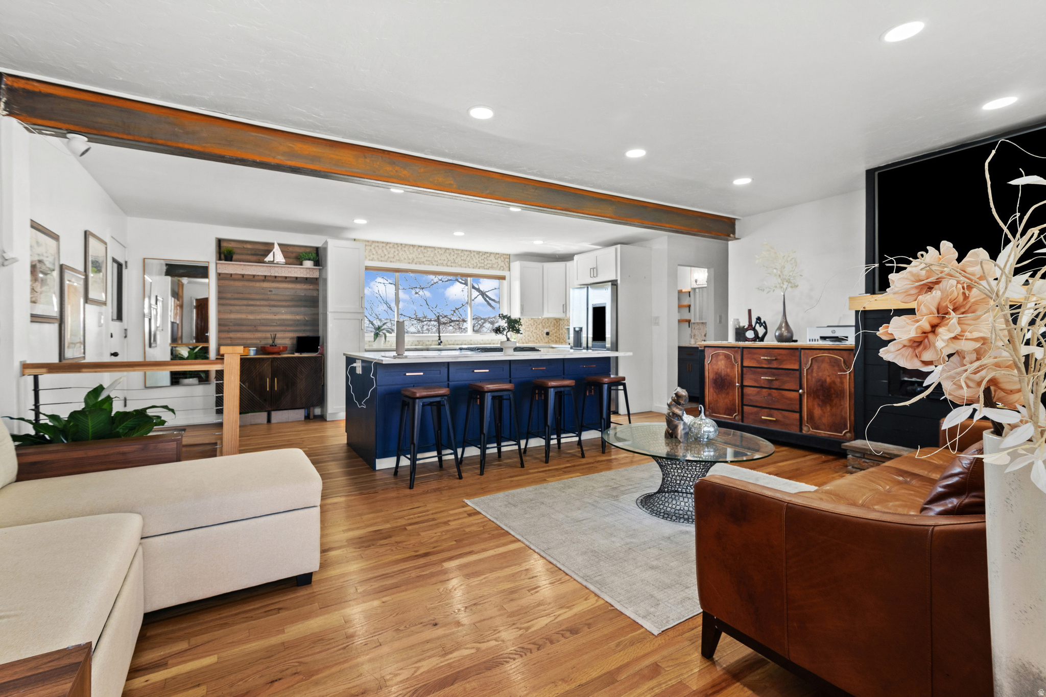 Welcome Home to this lovely brick rambler nestled in a highly desirable neighborhood, perched on the Bountiful hills and offering breathtaking mountain views. Thoughtfully updated in 2021, the main living area was beautifully remodeled into an open-concept layout designed for both everyday living and effortless entertaining. At the heart of the home is a chef-inspired kitchen featuring an impressive 8' x 5' quartz island, gas range, stainless steel appliances, drawer microwave, and a stainless single-basin sink-perfect for gathering with family and friends. The primary bedroom includes its own private half bath for added convenience. Downstairs, the basement is currently configured as a 2-bedroom, 1-bath ADU with multiple private entrances (including two exterior access points), offering excellent flexibility for rental income, guests, or multi-generational living. The rear French door entry was previously a one-car garage and could easily be converted back if desired. Additional highlights include energy-efficient windows, central A/C, a membrane roof replaced in 2020, and a new water heater installed in Fall 2024. To top it all off, a FREE 1-year IBEX Home Warranty is included for added peace of mind. {DISCLAIMER}: Square footage figures are provided as a courtesy estimate only and were obtained from Davis County records. Buyer is advised to obtain an independent measurement to verify.