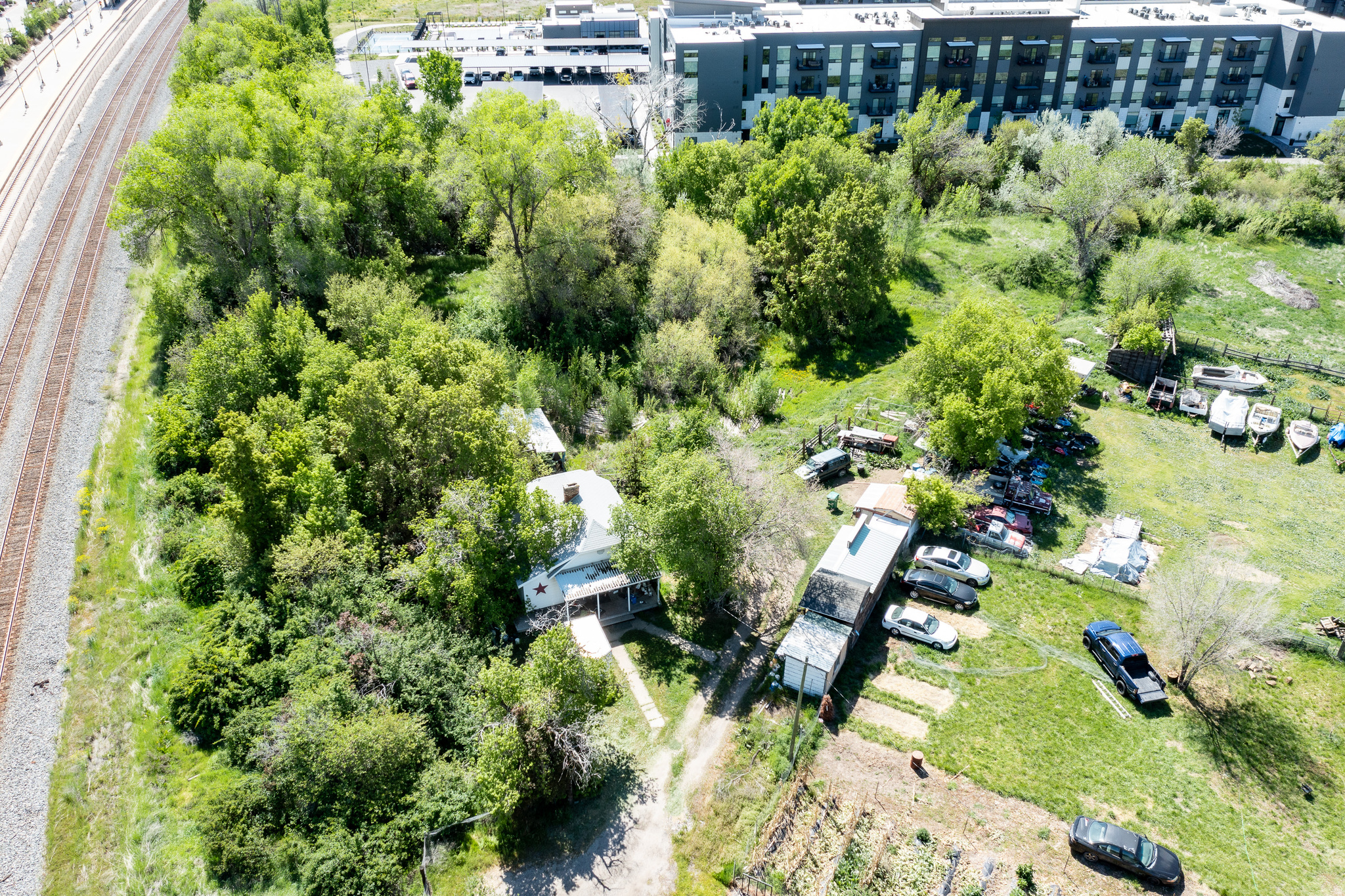 Rare opportunity to own over an acre in Layton with an existing home. Second parcel offers potential for additional use, expansion, or possible future building opportunity, subject to city approval. Renovate the current home, or build something new. Large lot with mature trees and a private setting. Value is primarily in the land.