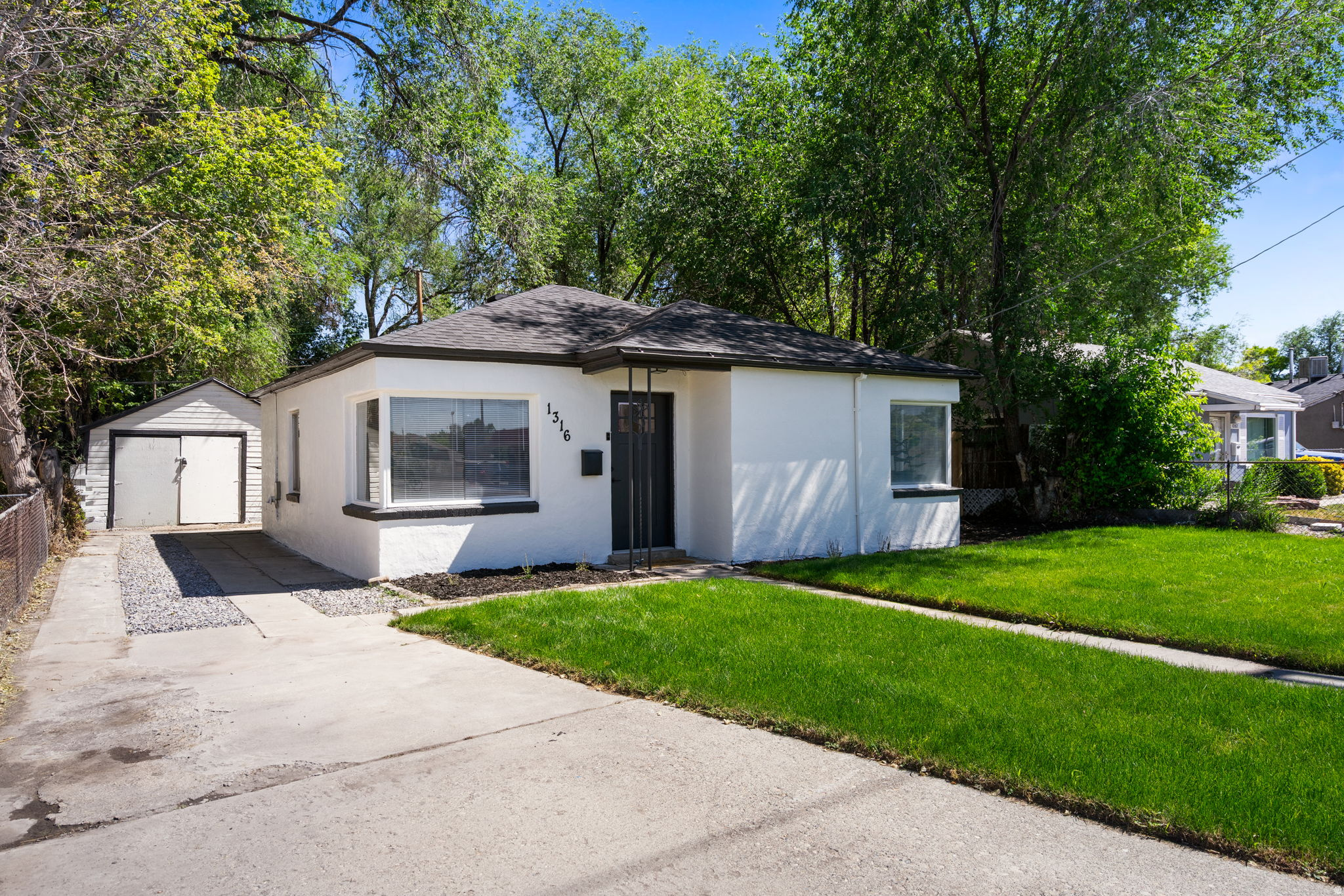 This charming and fully remodeled single-level home features a top to bottom remodel including ** NEW ROOF ** NEW CABINETS ** NEW COUNTERTOPS ** NEW APPLIANCES ** NEW BATHROOM ** NEW PAINT ** NEW LIGHTING AND PLUMBING FIXTURES ** NEW AUTO SPRINKLERS AND FRONT YARD LANDSCAPING ** Set on a generously sized lot, there are endless possibilities in the expansive back yard - ideal for gardening, entertaining, or even adding an Accessory Dwelling Unit (ADU). It offers a little breathing room while still being close to some of Salt Lake's best outdoor spots, including the Jordan River Parkway Trail and the International Peace Gardens. It's the kind of place that makes a lot more sense than continuing to pay rent. Whether you're looking for a sweet first home or a smart place to start building equity, this is it!