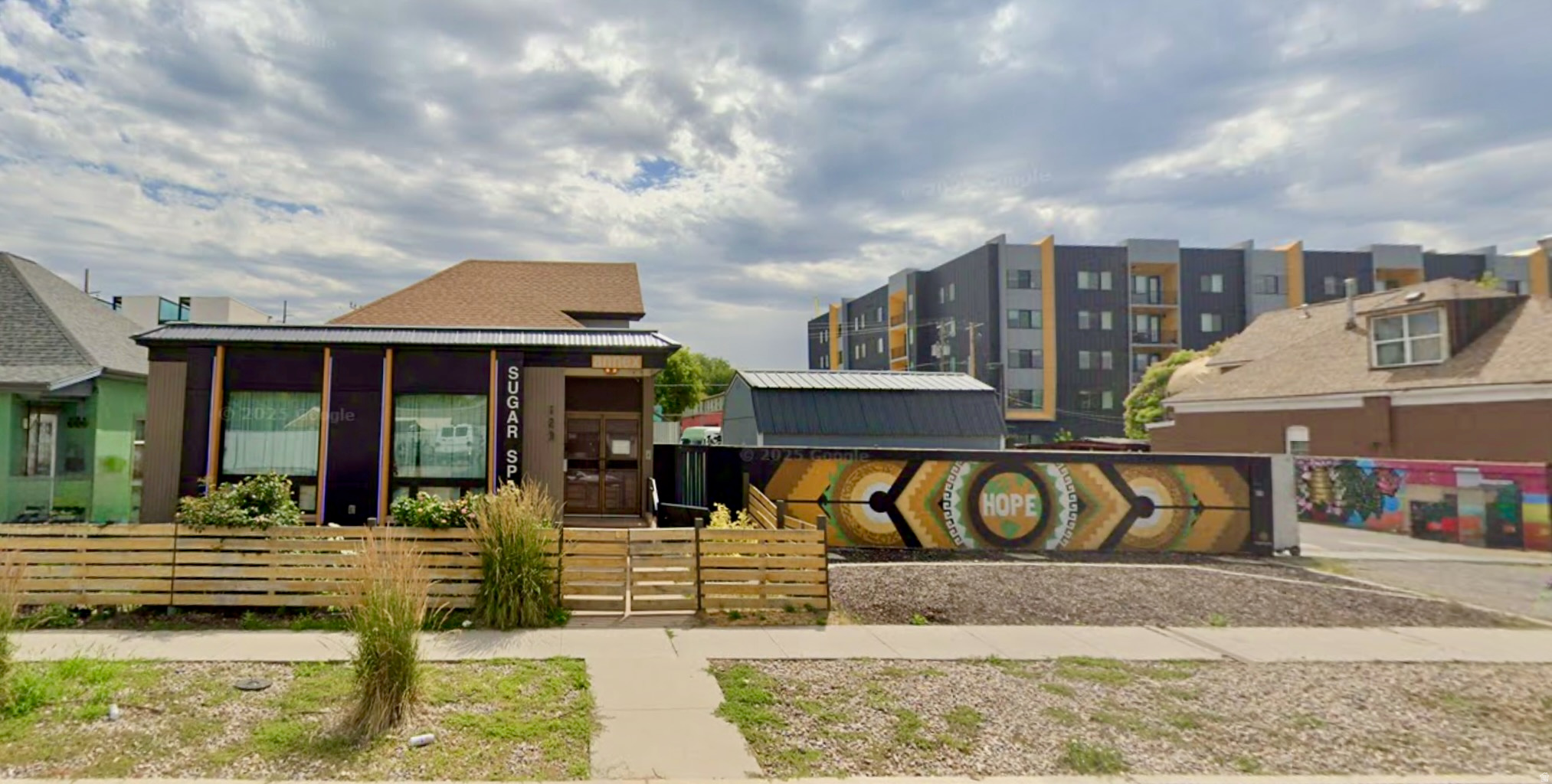Rare live/work opportunity to acquire a flexible mixed-use commercial property just one mile from downtown Salt Lake City. Property includes +/-2,693 square feet across two separate structures on 0.16 acres, featuring a +/-1,493 SF retail/mixed-use building and a +/-1,200 SF detached studio/workspace currently utilized as a dance studio. (cont.) The layout supports a wide range of uses including retail, showroom, studio, light production, or service-based operations. Outdoor area may support parking, storage, or expanded use (buyer to verify). Parking may be obtained by city approval and the installation of curb cuts and approach.  Its configuration also presents potential for a live/work environment (buyer to verify), appealing to owner-users seeking both visibility and functional workspace.  Existing parcel is adjacent to an established event venue, caf, and arts campus with proven programming history. For qualified buyers, seller may consider discussions regarding additional adjacent land/parking expansion for boutique hospitality, mixed-use, or redevelopment concepts. Buyer to verify all zoning, parking, and development feasibility. Opportunity Zone located.  All information provided as a courtesy. Buyer to verify.