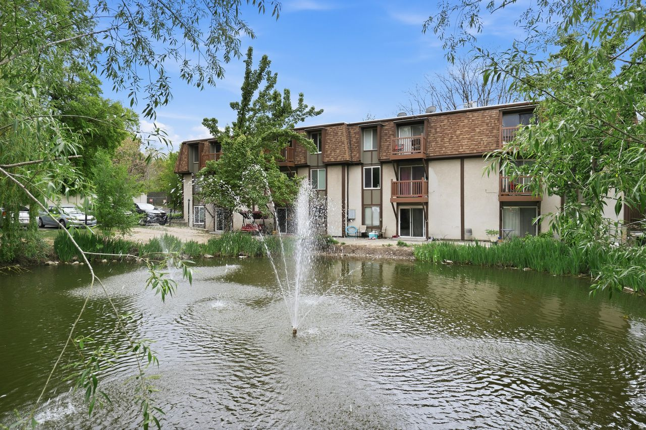 Located in the established and highly desirable Willows Community in Murray, this rare main-floor condo offers a deep sense of peace and retreat. As you drive into the neighborhood, you are instantly met by a lush canopy of mature trees, tranquil ponds, and the soothing sound of running water fountains. Step inside this charming mainfloor condo, where you are immediately welcomed by warm finishes, abundant natural daylight, newer interior elements; updated Kitchen with slate flooring & LVP flooring in main living areas. Stylish cabinetry with a warm wood finish and a cozy fireplace provide both character and ambiance, making the space perfect for relaxing evenings. The updated kitchen blends modern style with function, featuring newer cabinetry with a contemporary twist, seamless solidsurface countertops, and newer-like appliances including a gas stove, microwave, and refrigerator. Your kitchen, dining, and living spaces connect seamlessly to an outdoor sanctuary ideal for relaxing and enjoying nature.  The condo features two spacious bedrooms with large windows and walkin closets. An updated bathroom includes a newer vanity, custom shelving, and a glass sink with a separate toilet area and shower/tub combo. Offering a 1 car garage space & an addtional parking space near entry. Enjoy a comfortable, peaceful lifestyle close to city amenities, with access to a seasonal community pool and clubhouse within the Willows Community.
