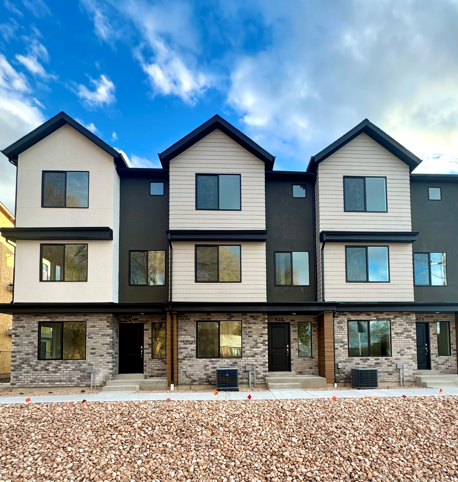 Set to complete end of October; Welcome to the Haven at Midtown Village in Ogden-an efficient 3-story townhome middle-Unit offering 4 bedrooms, 3 bathrooms, and a 2-car garage. The entry level includes a private bedroom and full bath-ideal for guests or a home office. The open-concept main floor features a modern kitchen with a large island and stainless-steel appliances, flowing into the dining and family areas. Upstairs offers additional bedrooms, laundry, and a spacious primary suite with walk-in closet and private bath. Enjoy low-maintenance living with HOA-maintained landscaping-schedule your showing today! ***ASK ME ABOUT THE BELOW MARKET INCENTIVE RATES with our preferred lender + $$$ towards Closing costs! *** No representation or warranties are made regarding school districts or assignments. Photos may be of a similar home. Buyers to verify all colors, materials, options, and square footage, which is provided as an estimate from building plans. Sales Center Hours: Mon, Tue, Thu, Fri, Sat: 11 AM  6 PM Wed: 1 PM  6 PM | Closed Sun Call to schedule your visit!