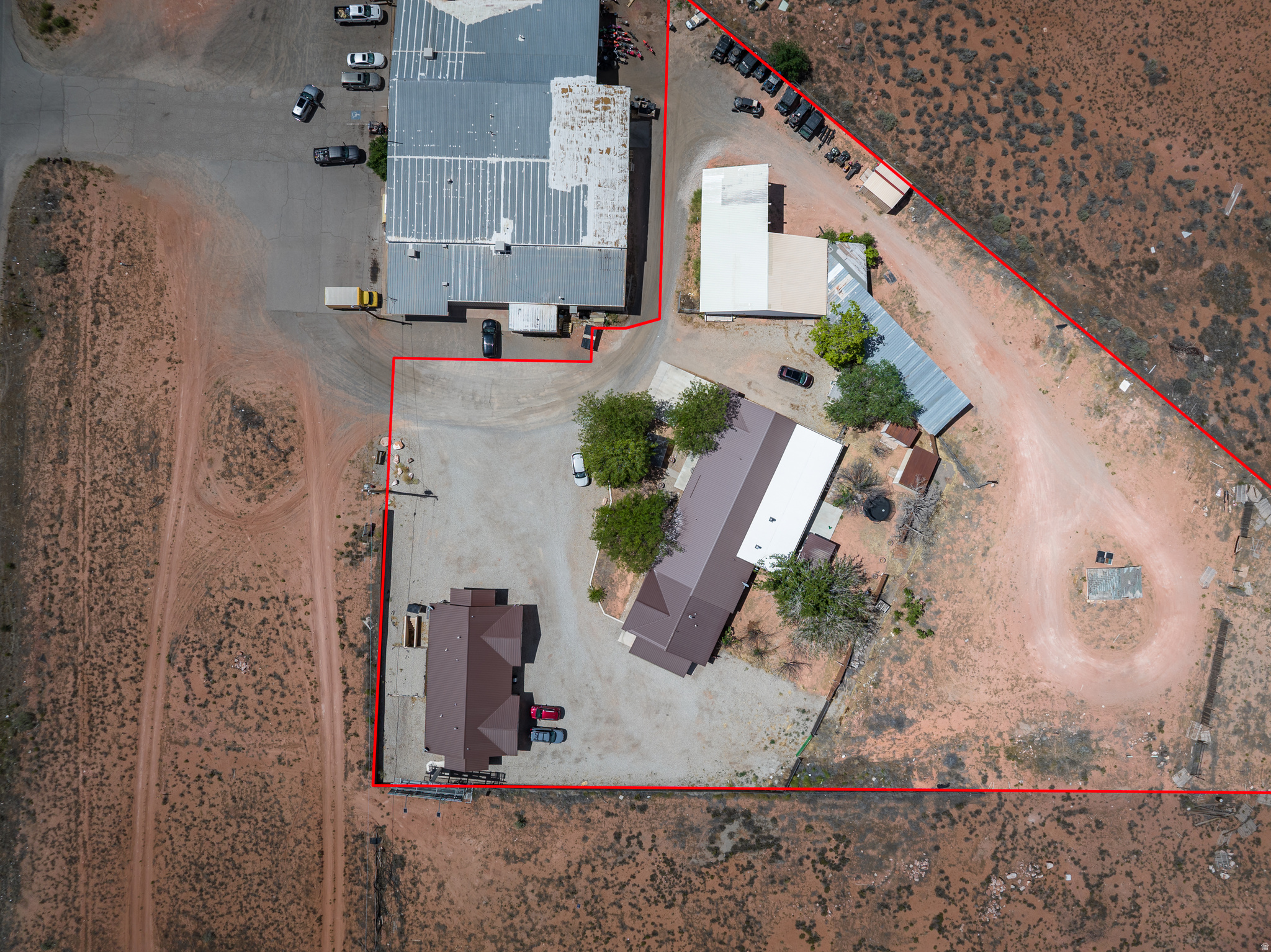 Exceptional Investment Opportunity on Commercial Highway Frontage!  Unlock the potential of this unique income producing property situated on 2.17 acres with additional acreage available for future expansion. This versatile investment features a spacious 5,000 sq. ft. main residence, three established short-term rental units of approximately 1,100 sq. ft. each, and a large shop offering endless possibilities for storage, business operations, or additional revenue streams.   Perfectly positioned on a commercial highway corridor, this property offers excellent visibility and accessibility while generating multiple sources of income. The short-term rentals provide immediate cash flow, while the expansive main home could serve as an owner-occupied residence, corporate retreat, long-term rental, or additional hospitality opportunity.  Square footage figures are provided as a courtesy estimate only and were obtained from county.  Buyer is advised to obtain an independent measurement.