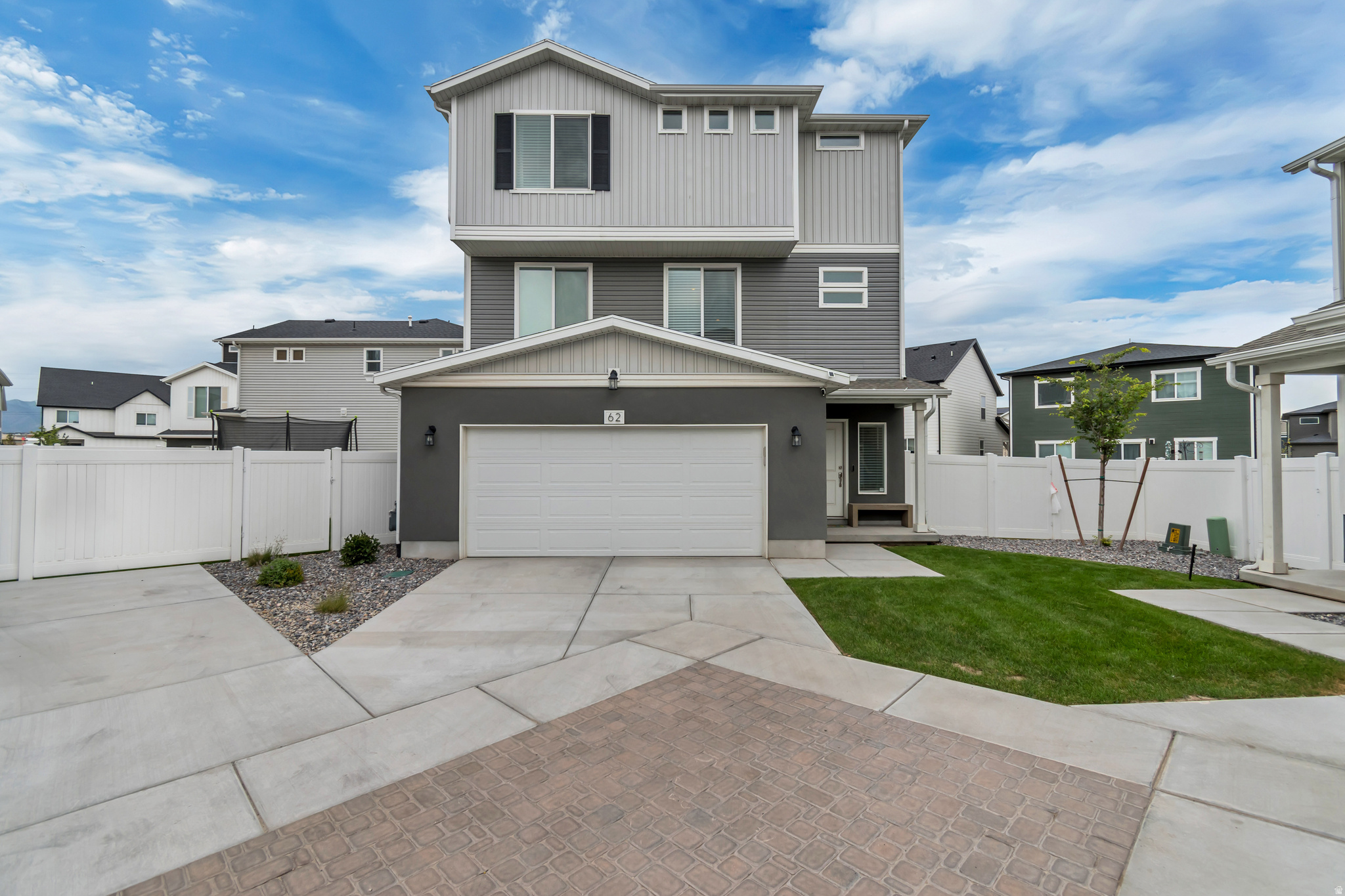 Welcome to a beautifully maintained home offering the perfect blend of modern style, comfort, and functionality. The bright, open-concept main floor features luxury flooring, abundant natural light, and a spacious living area that flows seamlessly into the stunning kitchen. You'll love the oversized island with seating, quartz countertops, stainless steel appliances, ample cabinetry, and a generous pantry-perfect for entertaining or everyday living. Upstairs, the spacious primary suite offers a private retreat with a walk-in closet and an ensuite bathroom featuring dual vanities. Additional bedrooms provide flexibility for family, guests, or a home office. Convenient upstairs laundry makes daily living even easier. Step outside to a fully fenced backyard with a covered patio and plenty of room for kids, pets, gardening, or summer barbecues. The attached two-car garage and attractive curb appeal complete the package. Located in a desirable Saratoga Springs neighborhood close to parks, schools, shopping, dining, and outdoor recreation, this home offers the ideal combination of convenience and lifestyle.