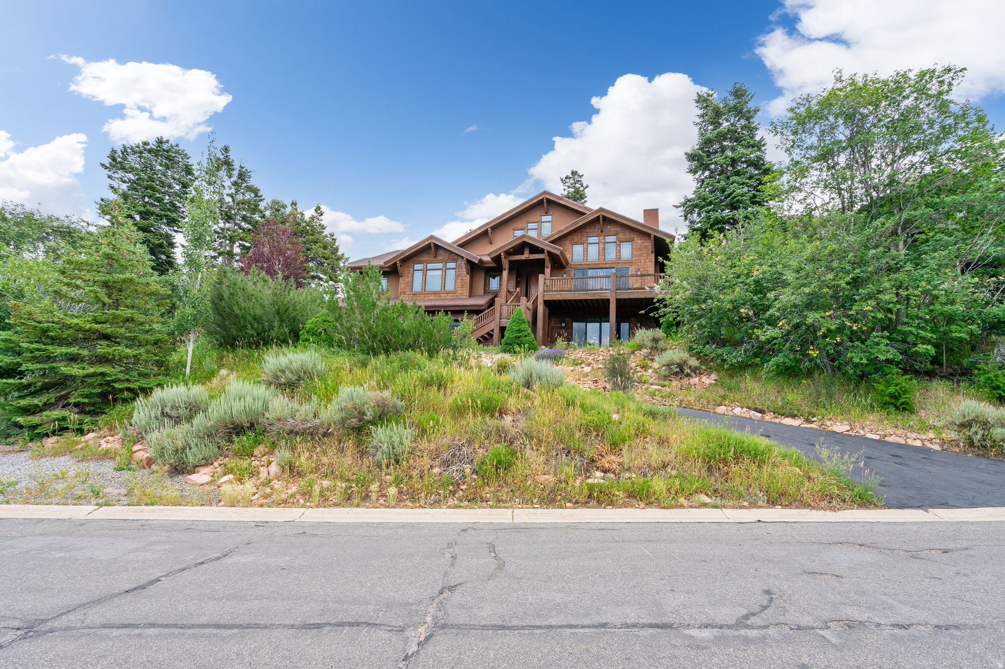 Just minutes from world class ski slopes and iconic winter Olympic venues, this stunning property offers breathtaking views and unmatched mountain living with a spacious, classic Park City design. This home blends rustic charm with modern elegance, featuring expansive living areas and top tier finishes. Sit on your deck and take in the beautiful scenery and wildlife. Outdoor adventure includes everything from skiing and snowboarding to hiking and biking right outside your door. Experience mountain living at its finest! Square footage figures are provided as a courtesy estimate only and were obtained from county records. Buyer is advised to obtain an independent measurement.