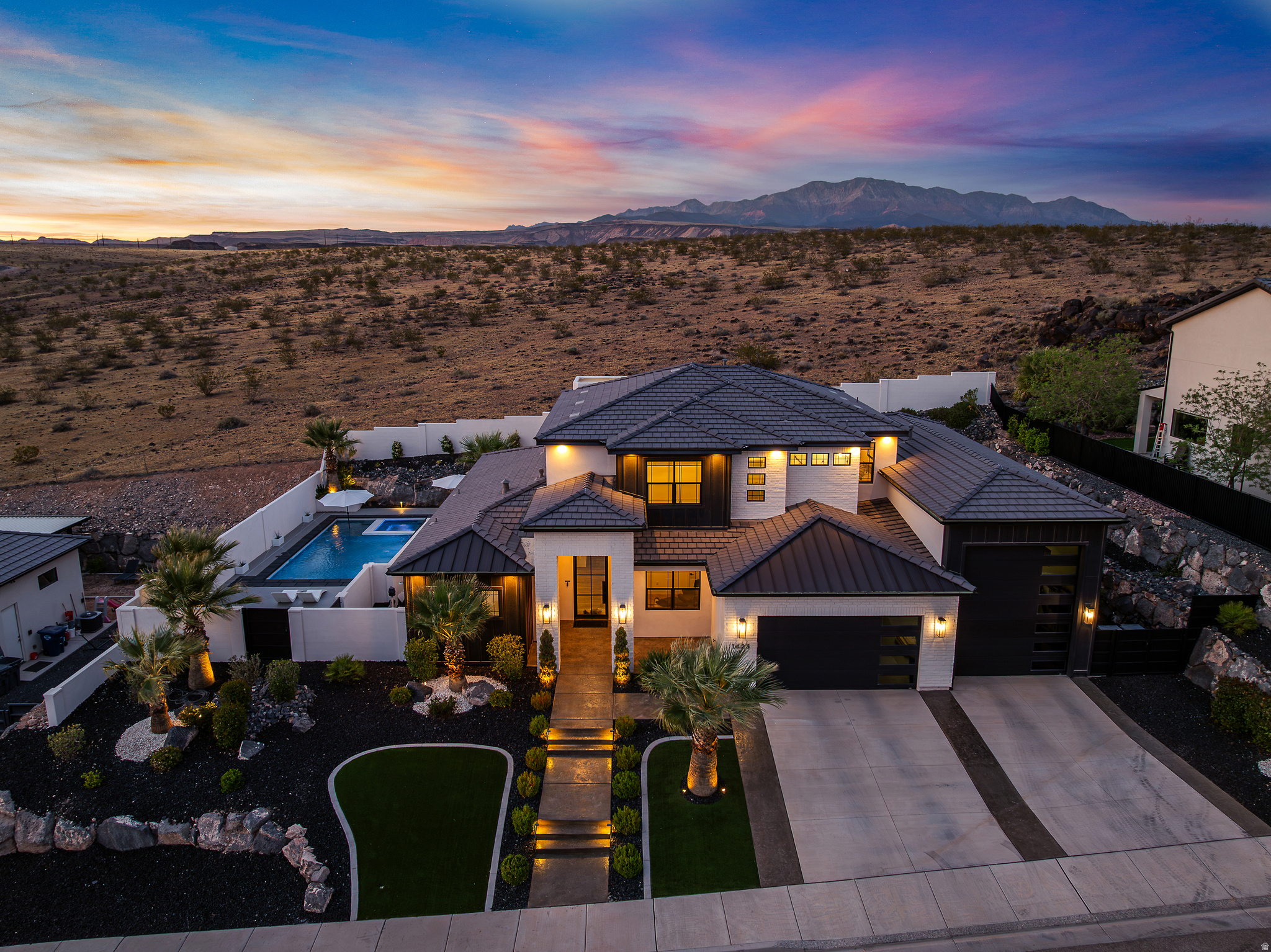 No rear neighbors. Backs directly to Red Cliffs National Conservation Area with open desert and mountain views.  Pool and hot tub with Shamu shelf, crushed quartz epoxy decking, stucco privacy walls, and plush landscaping create a true backyard oasis.  5 bedrooms, office, upstairs family room, and covered deck. Hidden storage room above the RV garage.  Kitchen features double ovens, drop-in cooktop, quartz countertops, large island, and custom cabinetry. Gas fireplace with built-ins. Main-level primary suite with double vanity, soaking tub, and walk-in tiled shower.  38 ft deep RV/boat garage (approx. 12' wide x 14' tall door) plus gated side parking. Ceramic-coated windows with lifetime warranty, water heater booster, whole-house surge protector, and 3 HVAC systems. Minutes from restaurants, shopping, hiking and biking trails.  Occupied. Shown by appointment only.  All information deemed reliable; buyer to verify.