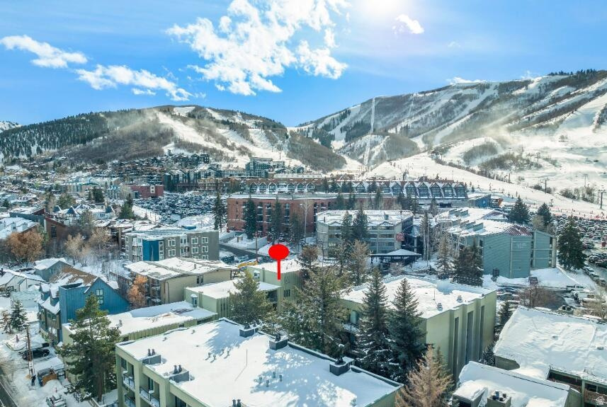 The Park City Mountain base lot is closer to your front door than most people's parking spot is to the lifts. From #P4 at Edelweiss Haus, you walk to the snow with boots on, skis over your shoulder, no parking fees, no reservation apps, while your own car stays in the heated garage. Inside: Turnkey unit with a full 2024 remodel, light and bright throughout, with an open floorplan around a stone feature wall and gas fireplace, crisp designer finishes, and a sun-filled palette that makes it live large. Single-level, pool-level living, step out to the year-round heated pool, hot tub, and saunas. Sells fully furnished and rental-ready: walk in, store your skis in the ski storage. Investors: nightly rentals allowed. no mandated rental management company. self-manage or hire anyone, plus lock-out capability most Old Town condos can't offer. Active, highly rated short-term rental, transferring furnished and booking-ready. Portable A/C unit included. HOA dues cover every utility! electricity, gas, water, sewer, internet, cable, plus insurance, security, snow removal, and amenities, so carrying costs are genuinely predictable. Heated garage space, ski storage, and on-site laundry. On the free bus route, minutes to Main Street.