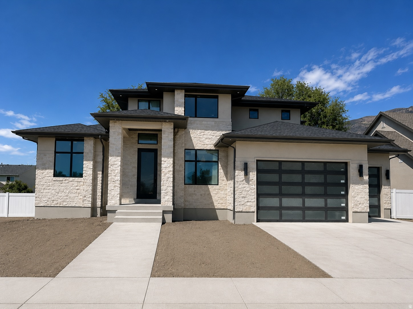 LOT#402. This is Symphony Homes' popular "Accord XL" floor plan, under construction and expected to be completed by July! Price includes full yard landscaping too! Gorgeous home with modern appeal inside and out! Award-winning builder of semi-custom homes, known for quality, craftsmanship and design. Primary suite will have a wood beam  ceiling, an impressive bathroom, and a huge custom wardrobe room with a window and laundry hookups. Engineered hardwood floors. Galley kitchen with upgraded 48" gas range, decorative hood, a side by side fridge/freezer included, huge walk-in "butler's" pantry with shelves and countertop, and spacious dining nook. Family room with a stunning 2-story high stone fireplace on interior wall and a soaring ceiling. Basement will be finished and features a wet bar complete with a microwave and beverage fridge  perfect for entertaining guests! Huge covered deck. Tons of storage space. 3rd stall of garage is 39' deep.