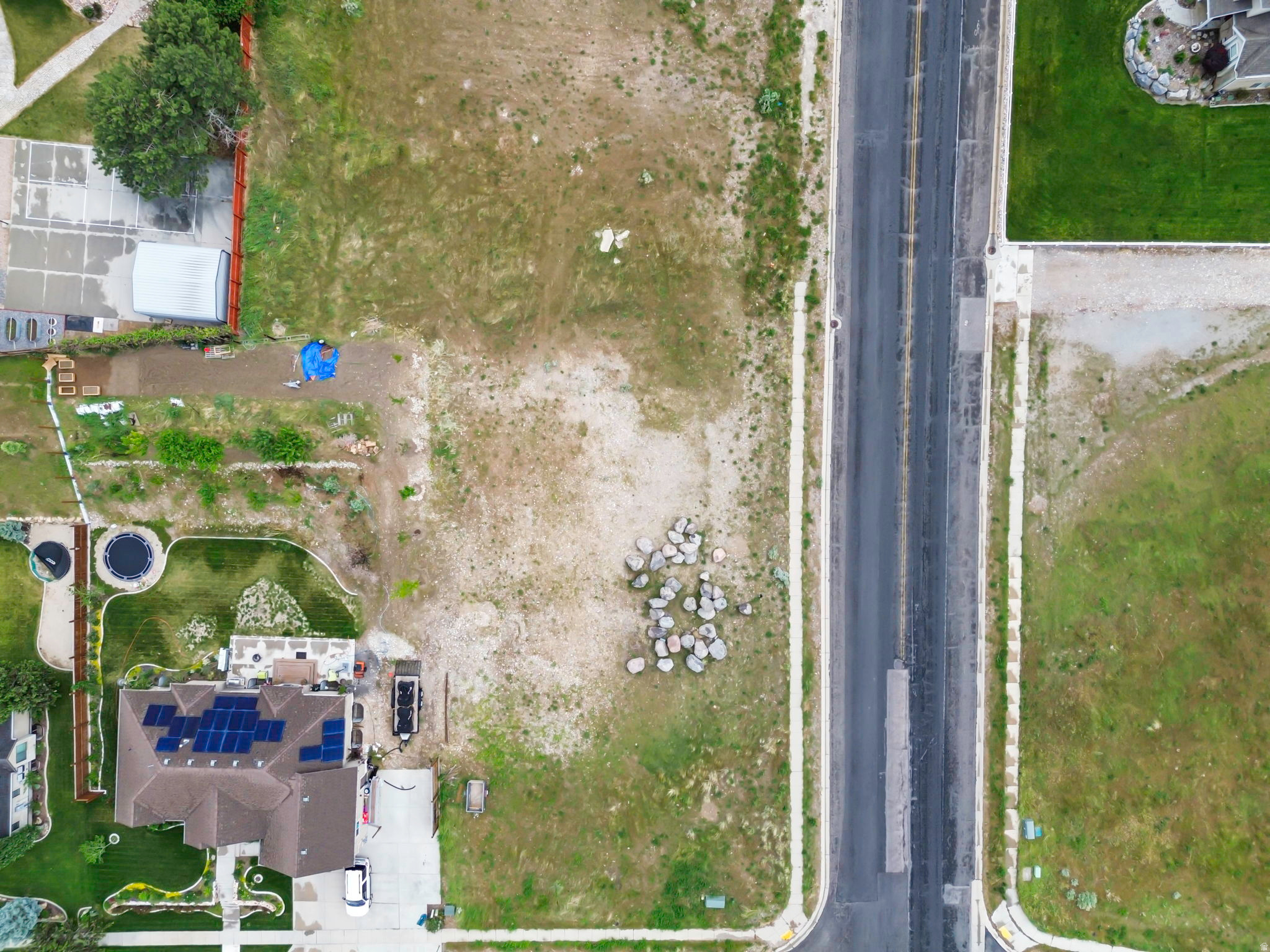 Discover the perfect opportunity to build your dream home on this spacious corner lot in the highly desirable community of Elk Ridge! Situated on .403 acres, this prime homesite offers breathtaking mountain and valley views, extra space and flexibility with its corner lot location, and the peaceful charm of small-town living while still being just minutes from city conveniences. Whether you're envisioning a custom estate, room for outdoor living, or simply a place to enjoy Utah's beautiful scenery, this property provides the ideal canvas. Don't miss your chance to own one of the few available lots in this sought-after area! Square footage figures are provided as a courtesy estimate only and were obtained from appraisal; buyer is advised to obtain an independent measurement.