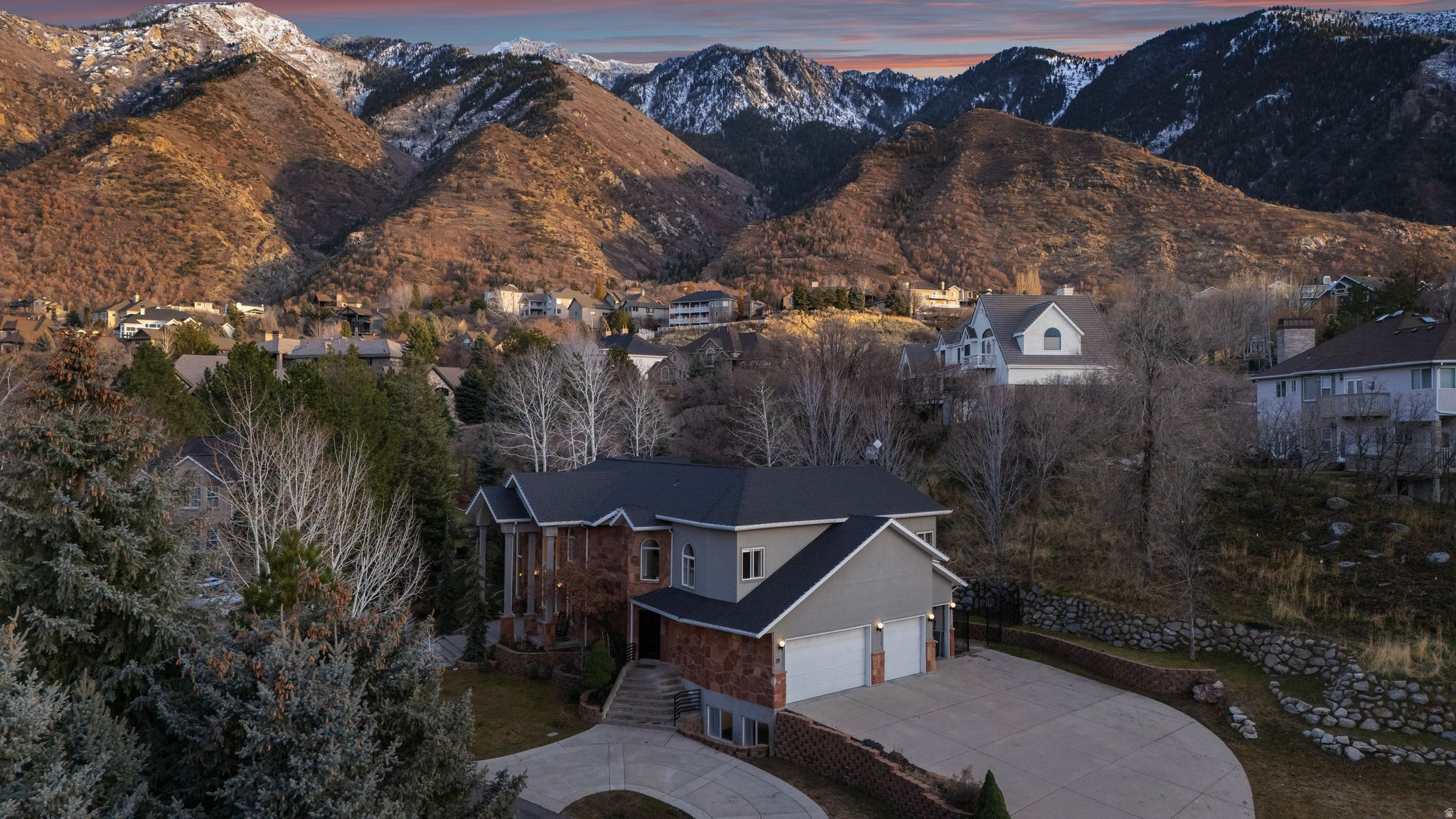 *BACK ON THE MARKET. BUYERS FINANCING FELL THROUGH* Located within Minutes to World Class Ski Resorts,Hiking/Biking Trails,Recreational Facilities, Discover an extraordinary residence in the prestigious,24 hr guard-gated Pepperwood community-one of Salt Lake Valley's most sought-after enclaves. This impressive renovated 8413 sq ft luxury estate offers a rare combination of timeless craftsmanship, modern sophistication, and resort-style living. Perfectly positioned on a beautiful lot with mountain views & extra parking, this home is designed for both grand entertaining and comfortable everyday living.  From the moment you step inside, you are welcomed by soaring ceilings, expansive windows, and an abundance of natural light that showcases the home's meticulous design. The flowing floor plan features multiple gathering spaces, thoughtfully curated finishes throughout, elegant formal rooms, a gourmet chef's kitchen featuring double ovens, full refrigerator/freezer, a 48" gas burner cooktop, a main & prep sink and an oversized wall of windows that open to your private outdoor living to relax and re-juvinate while absorbing the mountain views and nature. Every detail has been crafted to create an atmosphere of refined elegance-ideal for hosting celebrations, welcoming guests, or simply enjoying peaceful evenings at home. A rare find is on the second level,  including two spacious primary bedroom suites that serve as a luxurious retreat, one offering serene mountain views from your balcony, a spa-inspired bathroom, and both have generous walk in closet space. large laundry room with extensive cabinets, folding counters, and a full pet shower thats being completed.Additional bedrooms and living areas provide flexibility for multi-generational living, work-from-home arrangements, or extended-stay guests.The Daylight lower level has a private separate entrance to the large and open 1700 sq ft ensuite Mother In Law apt with full kitchen, laundry, family room, 2 bedrooms & 2 bathrooms.  Outdoor living is elevated with Pepperwood's unmatched amenities, including  Swimming pool, Hot Tub,Splash Pad,Life Guards,Competition Pepperwood Swim Team,Sand Volleyball,Basketball, Tennis and Pickleball courts, Playground, Park, Special events and private walking/biking trails through out the 477 acres. Combined with the home's own outdoor entertaining areas,including a 15-person hot tub with remote control and bb court. You'll enjoy a lifestyle that feels both exclusive and welcoming.Invisible fence for cats and dogs is included.Furniture is for sale for a great value.Buyer to verify all information.
