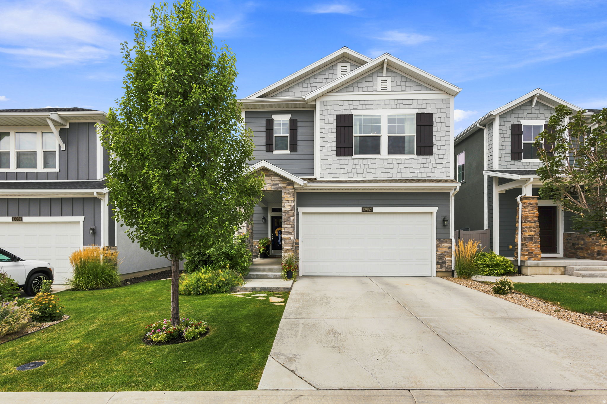 Beautifully upgraded, like-new home in Draper's sought-after Ark subdivision! This spacious home features 4 bedrooms, 3.5 bathrooms, a versatile loft, and a newly finished basement complete with a stylish wet bar-perfect for entertaining, hosting guests, or multi-generational living.  Thoughtfully upgraded throughout, this home offers 9-foot ceilings, oversized windows, abundant natural light, designer lighting, and breathtaking mountain views from the primary suite. The open-concept layout creates an inviting space for everyday living and entertaining.  Escape to your private backyard sanctuary featuring a secluded patio, mature fruit trees, raised garden boxes, and beautifully landscaped grounds that provide the perfect setting for relaxing, gardening, or gathering with family and friends.  Located adjacent to Wheadon Farm Park and just minutes from the Draper Recreation Center, this home is also close to highly sought-after dual-language immersion schools offering French, Spanish, and Chinese programs. Enjoy quick access to I-15 and Bangerter Highway, making commuting throughout the Salt Lake Valley a breeze.  Move-in ready and loaded with upgrades, this exceptional home offers the perfect combination of luxury, comfort, and convenience in one of Draper's most desirable neighborhoods.