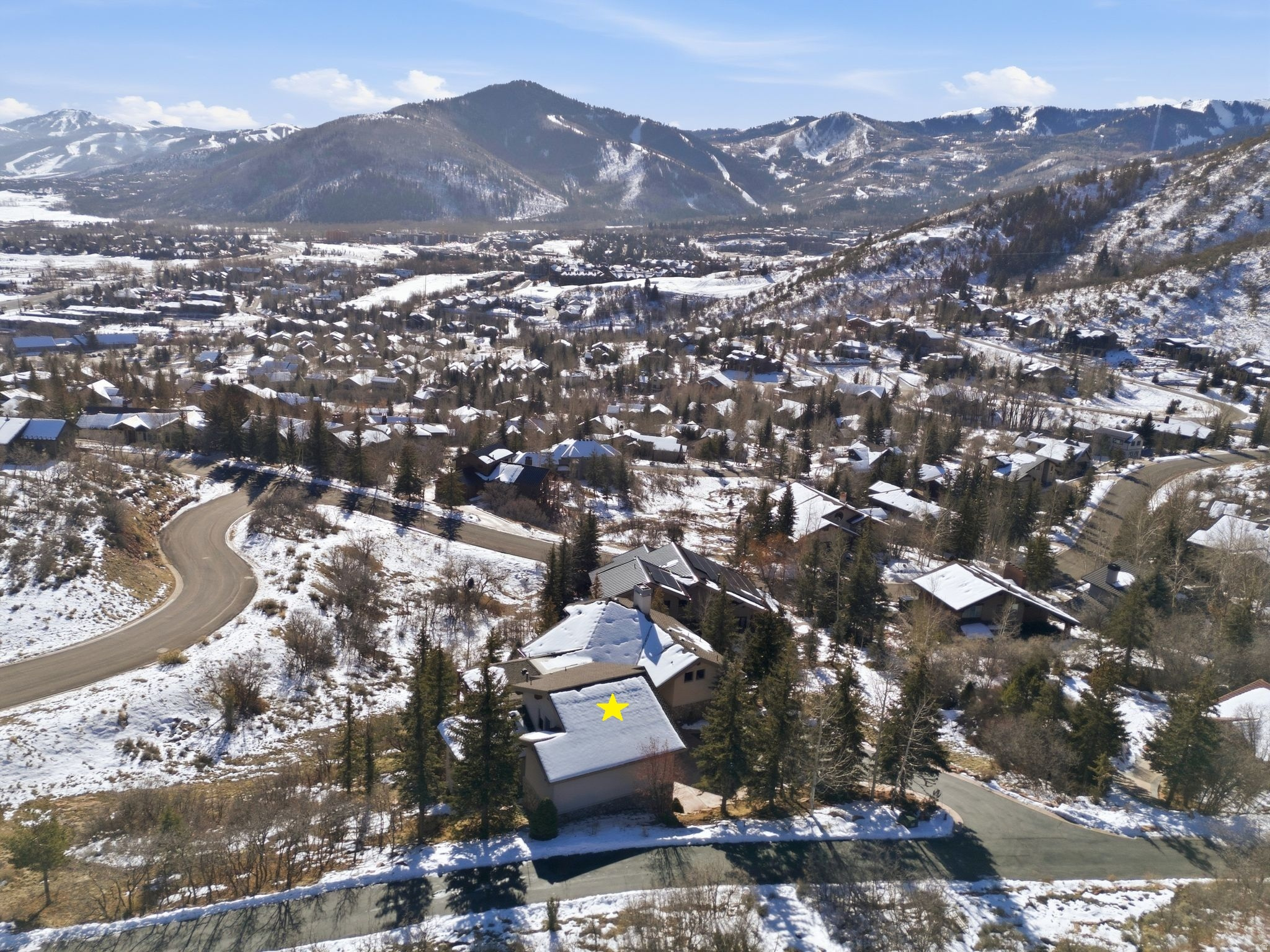 Unobstructed Ski Resort Views and Private Main-Level Living in Sun Peak. Tucked into a quiet cul-de-sac in Mahogany Hills within Sun Peak, this meticulously maintained 5,933-square-foot home offers comfortable living with unobstructed south-facing views toward Canyons Village and Deer Valley Resort. The setting feels quiet and private, yet remains close to everything. Designed around easy main-level living, the great room, kitchen, primary suite, office, and laundry are all positioned on one level for everyday convenience. Walls of windows frame the mountain views, while the open layout creates natural flow for daily life and entertaining. The walk-out lower level expands the space with a family room, four additional bedrooms, and three full bathrooms. A bonus game room with wet bar and theater sits above the three-car garage, complete with a west-facing window that captures beautiful sunsets. Set on a 0.66-acre lot with mature landscaping, the home offers easy access to neighborhood trails, with paved paths connecting to Main Street and Kimball Junction. You're minutes from world-class skiing: approximately 5 minutes to Canyons Village and 10 minutes to Deer Valley. Ownership includes access to the Sun Peak Club, featuring a pool, pickleball and tennis courts, fitness room, and clubhouse. A rare combination of views, layout, and location in one of Park City's most loved neighborhoods.