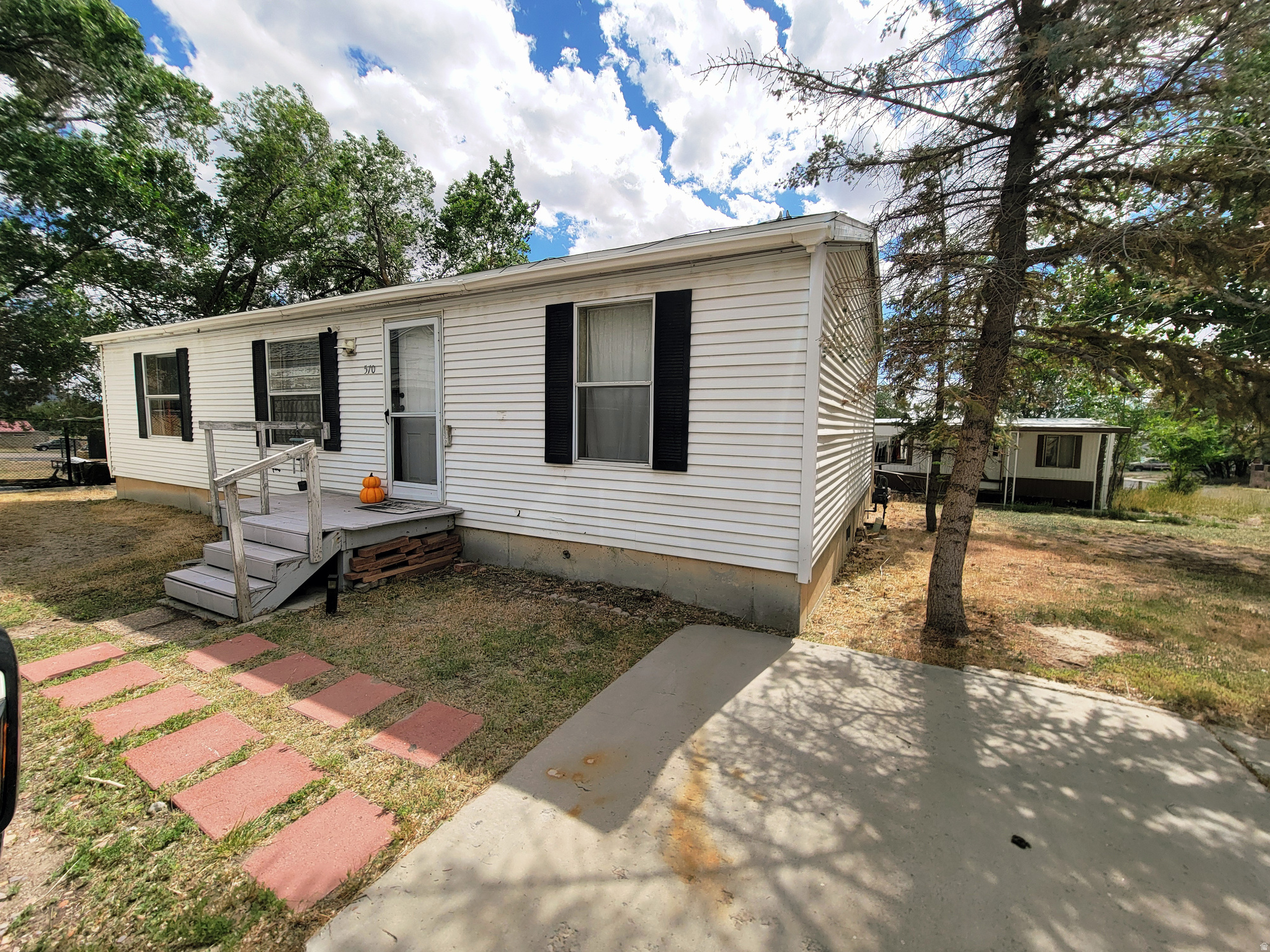 Charming 3-bedroom, 2-bath manufactured home in the peaceful community of Sunnyside! This cozy 960-square-foot gem has been lovingly remodeled. Both bathrooms and the kitchen feature modern updates, complemented by all-new flooring throughout. The home boasts a full PEX plumbing system, a brand-new water heater, and a water treatment filter that stays with the property-ensuring comfort and convenience for years to come. Located in the tight-knit town of Sunnyside, you'll enjoy a local grocery store just steps away, an elementary school a few miles down the road, and nearby churches and restaurants. Outdoor lovers will appreciate endless trails for hiking, ATV riding, and side-by-side adventures, all framed by stunning Carbon County views. Salt Lake City is about 2.5 hours away, Moab about 90 miles and Price just 25 miles away. Looking for a fresh start, look no further. Square footage to be verified.