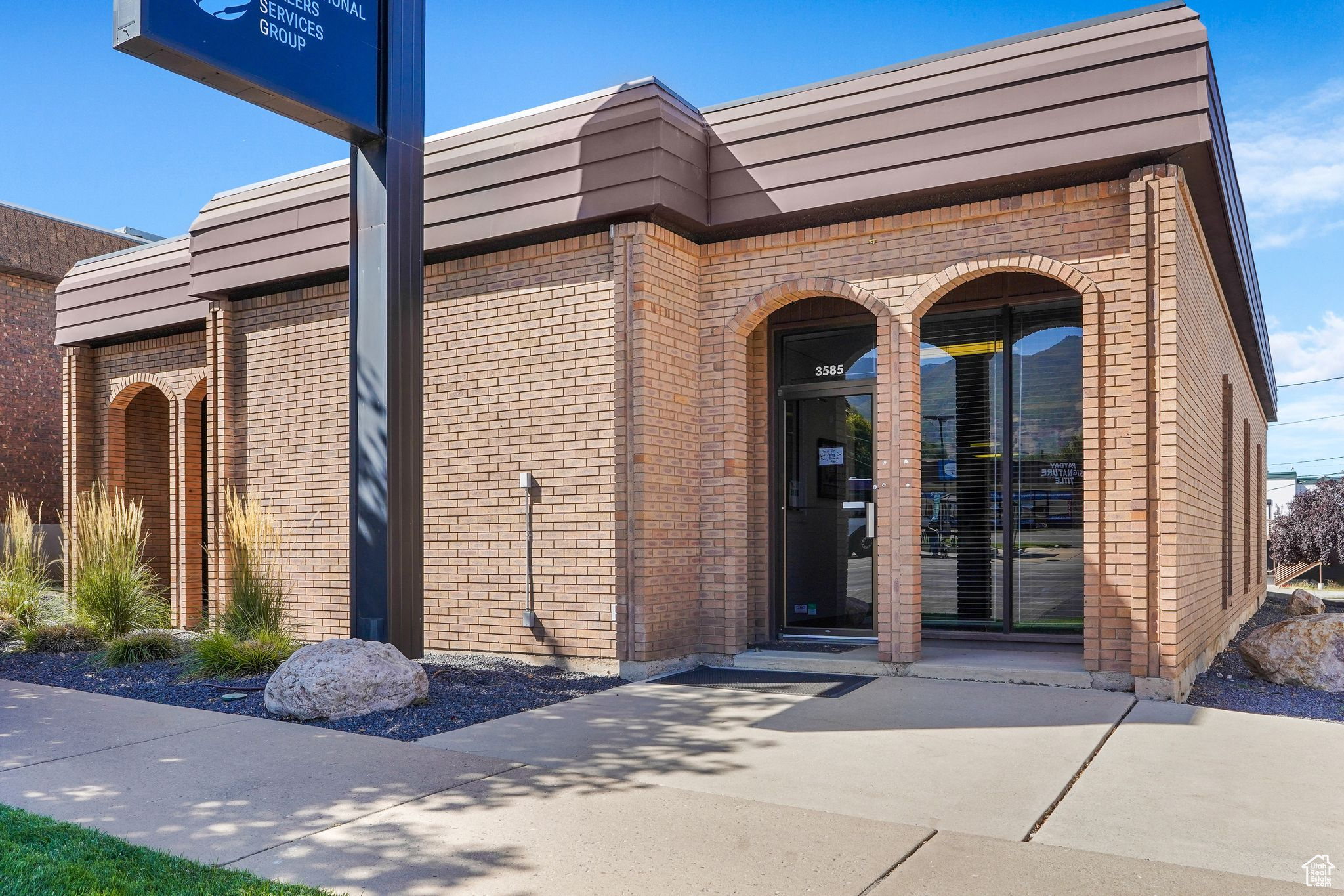 This impressive commercial property boasts exceptional frontage on Washington Blvd, offering outstanding visibility and accessibility in a highly desirable area.  Thoughtfully updated with modern finishes throughout, the main level features:  8 private glass-enclosed offices  sleek, modern, and perfect for a collaborative yet professional environment.  3 spacious executive offices  ideal for leadership, client meetings, or quiet workspaces.  Comfortable sitting/reception area  ideal for welcoming clients or visitors.  Bonus Feature: Full Apartment Below.  The basement level includes a fully separate 1-bedroom, 1-bath apartment with a private entrance, offering tremendous flexibility. Use it as:  An income-generating rental unit.  On-site staff housing or convert it into additional office or meeting space to expand operations.  Ample storage throughout enhances functionality, and the building layout supports a variety of business types.  This is a rare opportunity to own or lease a well-located, turnkey property with built-in versatility and long-term potential.