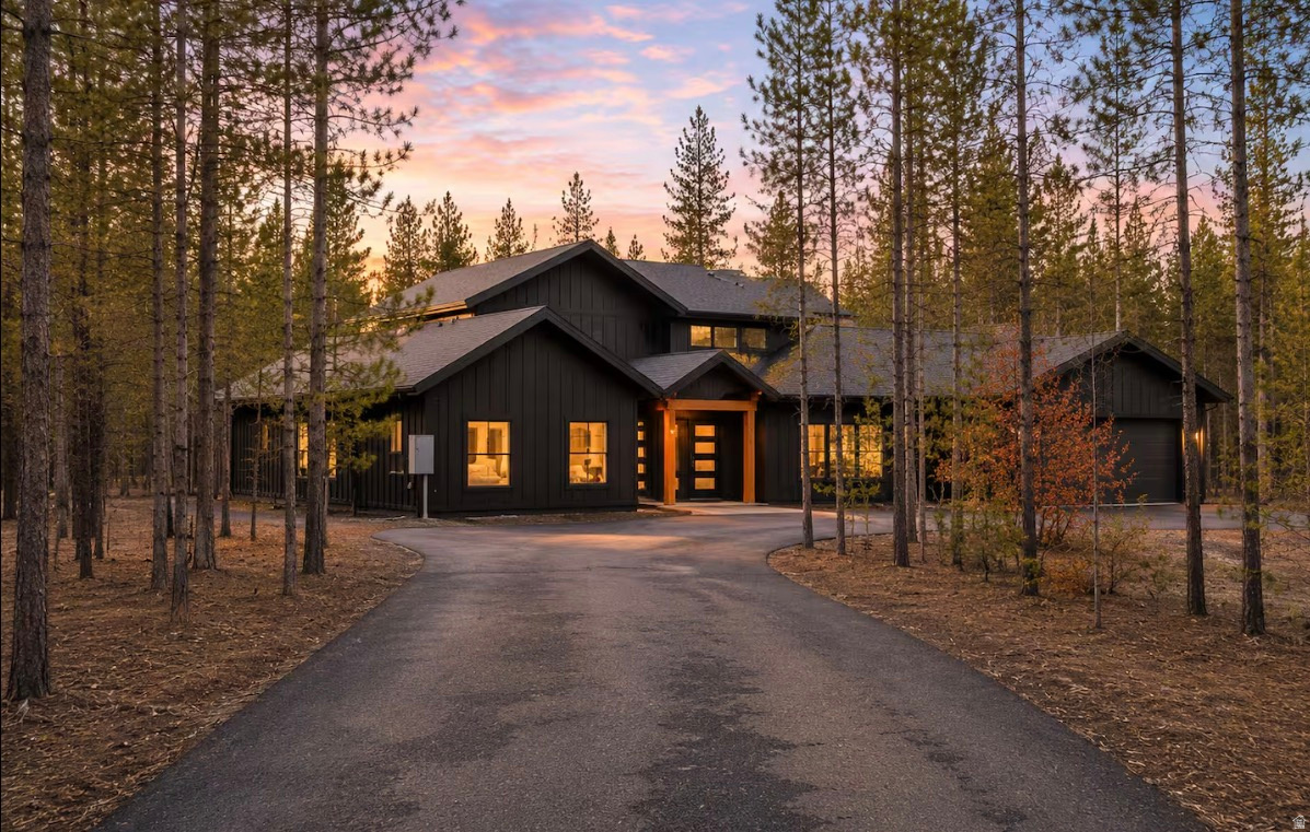 Video Tour https://youtu.be/ifCTk468Zmg Welcome to an exceptional retreat located within the gated, waterfront community of Silverhawk. Nestled on 1.54 acres of beautiful pine-covered property, this rare set up includes two fully furnished homes, creating the perfect opportunity for a private family compound, luxury vacation retreat, or income-producing rental property. The main residence spans 3,927 square feet and features 4 bedrooms and 4.5 bathrooms, with stunning vaulted ceilings and expansive living spaces designed to showcase the surrounding natural beauty. The property also includes a remarkable shop house, offering a 40' x 60' heated shop perfect for storing all the toys. Above the shop is an additional 2,400 square feet of living space featuring 3 bedrooms and 2 bathrooms. Enjoy a large covered upper deck ideal for relaxing and taking in the serene forest surroundings. There was no expense spared on the Bonus Features such as high effeciency radiant floor heat, water filtration system, asphalt driveway, digital controls and a full Generac System for each home. Whether you're looking for a luxury mountain getaway, multi-family retreat, or income-property, this one-of-a-kind property delivers the best of Idaho lake living and Yellowstone adventure.