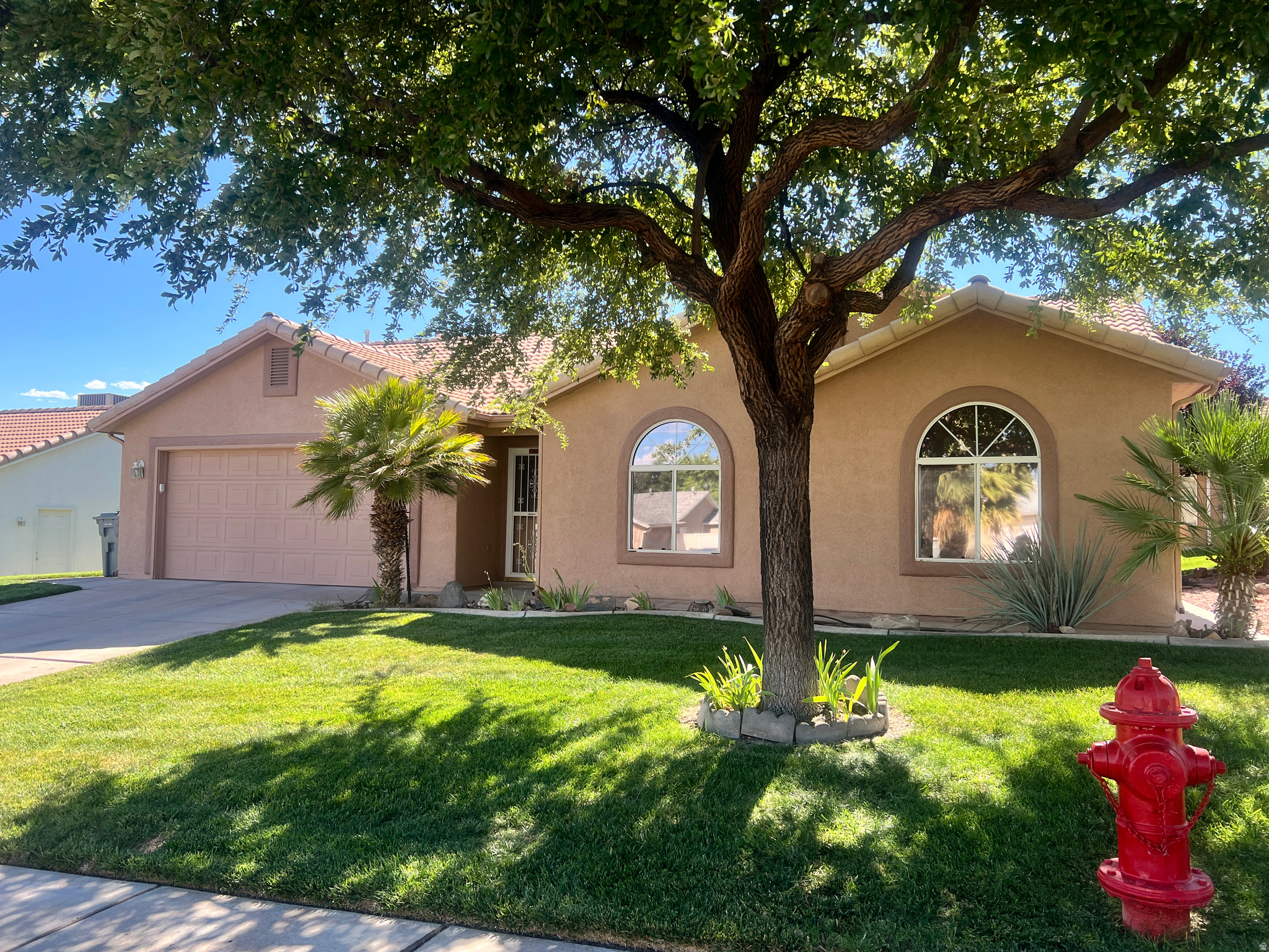 Located in a desirable 55+ community, this beautifully maintained home is in fantastic condition. This home is located on the outside edge of the HOA provides convenient street parking nearby. Close to shopping, dining, and the mall, this home offers both comfort and convenience. With the HOA taking care of the yard maintenance, easy living doesn't get much better than this.