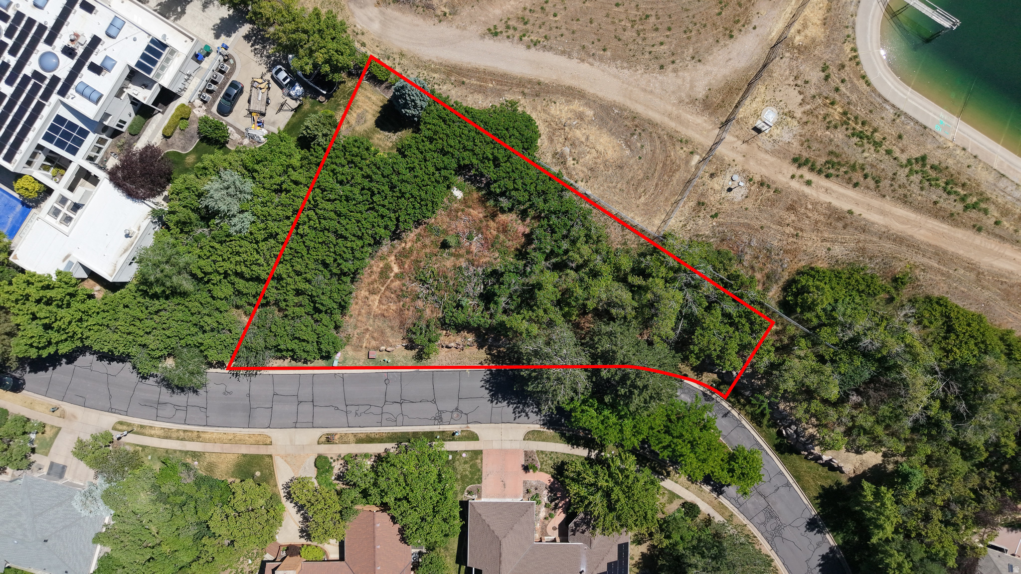 One of the last remaining gated estate lots on Ogden's East Bench. Panoramic views, mature pines, 250' frontage, secondary water, trails and golf nearby. Survey, geotech, and home design complete.  Minutes to downtown, Snowbasin, Powder Mountain, and Pineview. Agent is related to Seller.