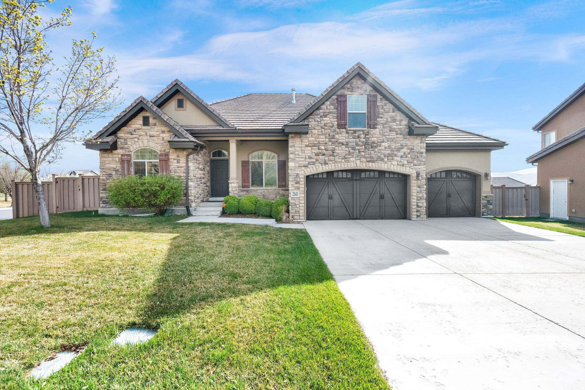 Welcome to this impeccably designed 4 bedroom plus loft with 4.5-bathroom home nestled on a spacious lot in the highly sought-after Traverse Mountain community. Enjoy access to exceptional HOA amenities including a community pool, fitness center with yoga & water aerobics, playground, tennis courts, pickleball, community activities, and miles of scenic hiking and biking trails. Inside, this thoughtfully designed home offers generous living spaces ideal for both everyday living and entertaining, including surround sound in the main living area and a dedicated theater room-also wired with surround sound-perfect for movie nights and hosting guests. (Equipment included) The sprawling primary suite offers vaulted ceilings, a walk in closet and ensuite bathroom. Unwind in your own spa-like steam shower room, adding a luxurious touch to your daily routine. Step outside to your private backyard, fully fenced and designed for both relaxation and entertainment. Take in breathtaking mountain views while enjoying the built-in gas fire pit, or host unforgettable gatherings with the outdoor kitchen featuring a built-in BBQ grill and sink. Raised garden beds provide the perfect space for planting and enjoying fresh homegrown produce. This exceptional property offers the perfect blend of indoor comfort, outdoor living, and community amenities-an incredible opportunity in one of Lehi's premier neighborhoods.   Square footage figures are provided as a courtesy estimate only.  Buyer is advised to obtain an independent measurement.