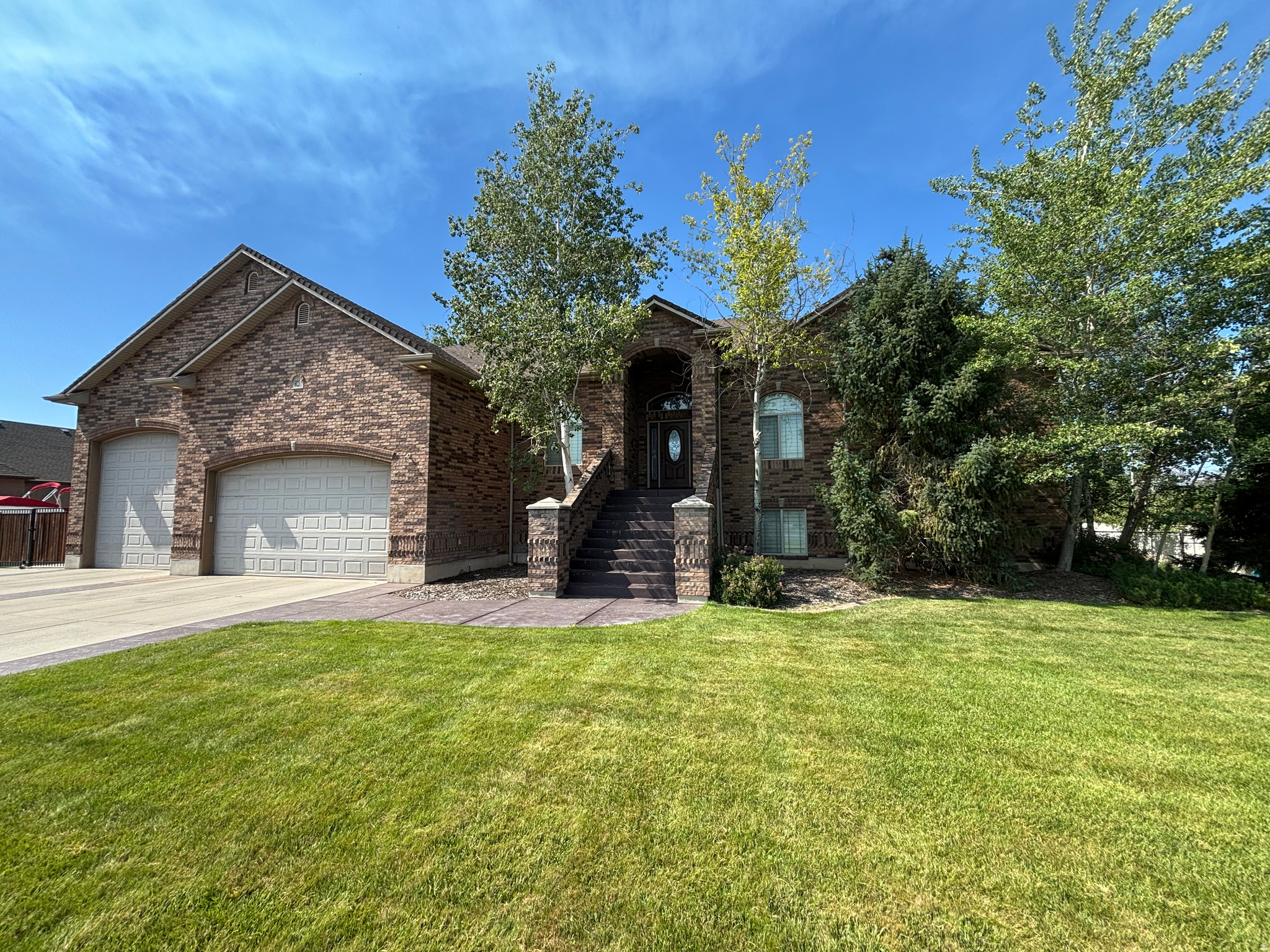 Beautiful home on .69 acre. Fully landscaped and fenced. Massive 5 car garage with RV pad and hookups. Horse property if desired. Six-bedroom home with travertine tile and granite countertops throughout. Large, covered deck with covered patio and walkout basement.  Spacious primary bedroom with jetted tub and separate shower.