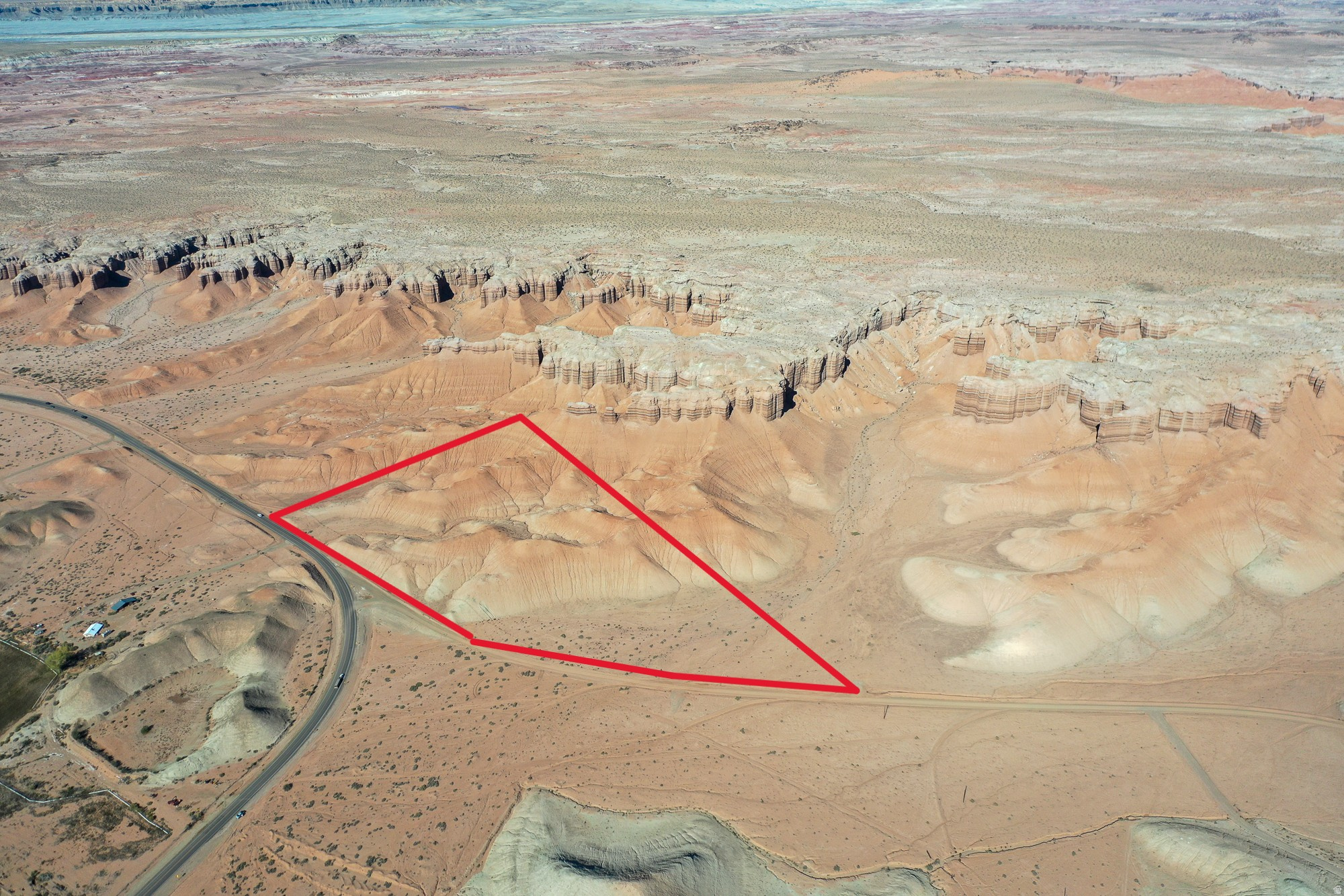 Percolation test done, property has water right. 21.45 acres. Survey pins show edges of property. 28 miles to Capitol Reef. 32 Miles To Goblin Valley. Buyer and buyers agent to verify all information. Pictures lot lines are approximate.
