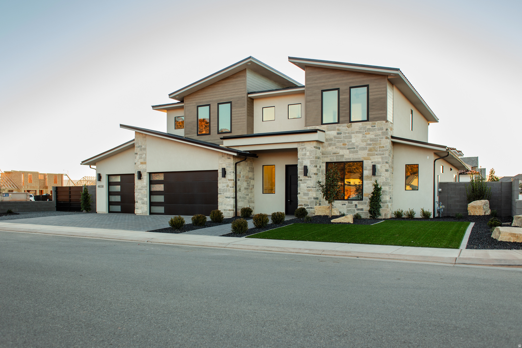 This stunning home features a pool, hot tub, and trampoline all on a fully landscaped, fenced lot. Just blocks from Crimson Cliffs High & Middle School. Inside, discover engineered wood floors, custom cabinetry, and a gourmet kitchen with drop-in cooktop, vented range hood, floor-to-ceiling cabinets, and quartz countertops. Additional features include a mudroom with locker cabinets, gas fireplace with built-in wall unit, spacious laundry with sink and storage, and walk-in pantry. The primary suite offers a freestanding tub, makeup vanity, tiled walk-in shower, and oversized closet with built-in drawers. An additional bedroom and full bath on the main level provides perfect accommodations for guests. All information deemed reliable but not guaranteed; buyer to verify all.