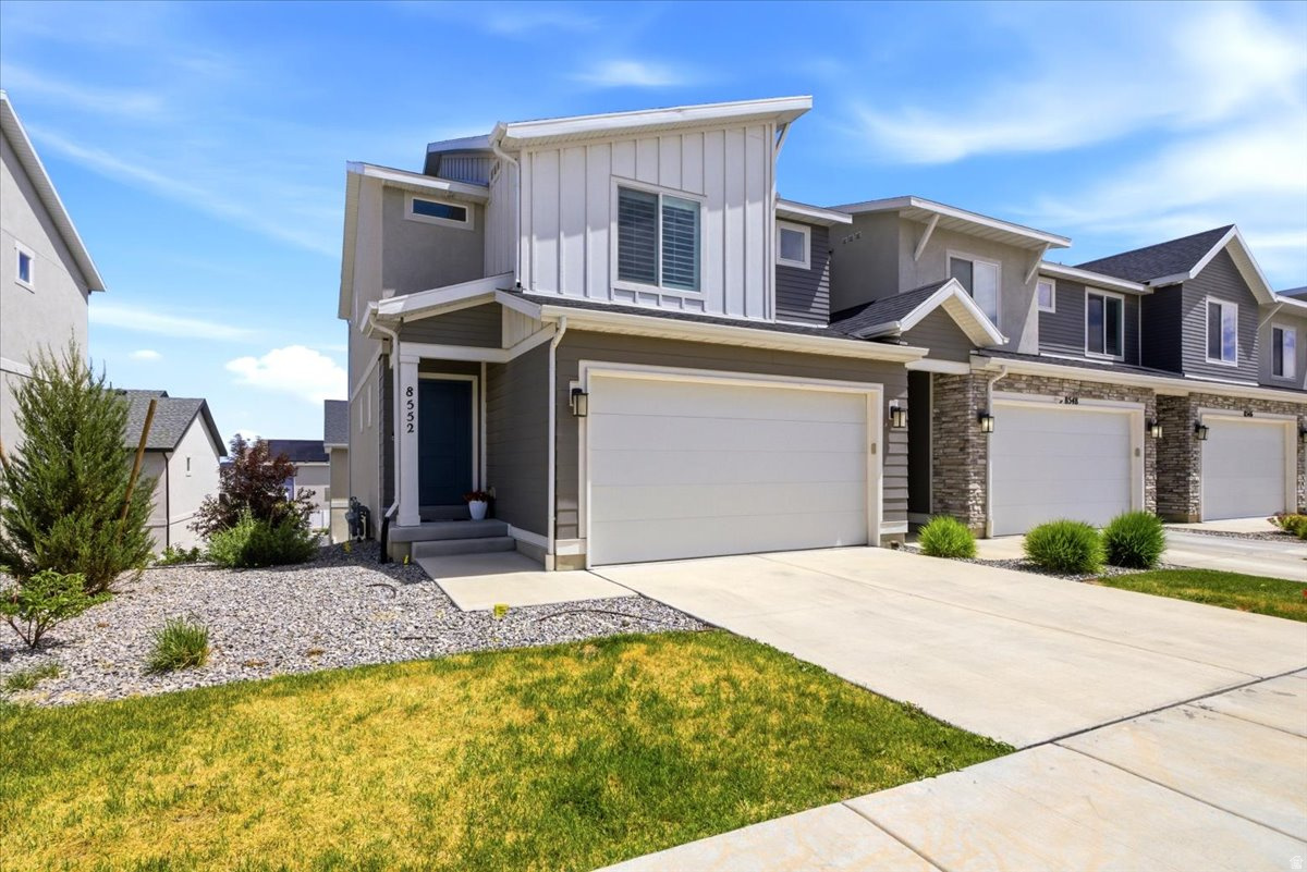 Tucked within a sought-after community, this turnkey townhome is move in ready!! Light and bright inviting main level showcases a spacious family room highlighted by upgraded laminate flooring, recessed lighting, and an open-concept layout designed for comfortable living and entertaining. The kitchen boasts quartz countertops, crisp white cabinetry, a spacious pantry, and sleek stainless-steel appliances. Enjoy views from the main floor deck. On the 2nd level, retreat to the primary suite complete with dual walk-in closets and private en suite bathroom. Two additional spacious bedrooms, a full bath, and the convenience of second-level laundry complete the upper floor. The unfinished daylight walkout basement offers room to grow-ideal for future living space, a home gym, theater, or guest suite. Perfectly situated within the community, this townhome is just moments from the clubhouse, pool, and pickleball courts, combining lifestyle amenities in one exceptional package.
