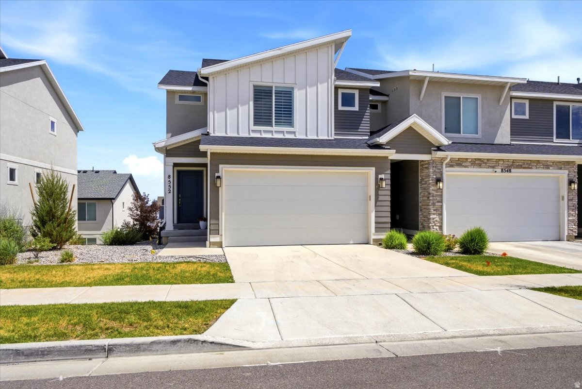 Back on the Market!! Tucked within a sought-after community, this turnkey townhome is move in ready!! Light and bright inviting main level showcases a spacious family room highlighted by upgraded laminate flooring, recessed lighting, and an open-concept layout designed for comfortable living and entertaining. The kitchen boasts quartz countertops, crisp white cabinetry, a spacious pantry, and sleek stainless-steel appliances. Enjoy views from the main floor deck. On the 2nd level, retreat to the primary suite complete with dual walk-in closets and private en suite bathroom. Two additional spacious bedrooms, a full bath, and the convenience of second-level laundry complete the upper floor. The unfinished daylight walkout basement offers room to grow-ideal for future living space, a home gym, theater, or guest suite. Perfectly situated within the community, this townhome is just moments from the clubhouse, pool, and pickleball courts, combining lifestyle amenities in one exceptional package.