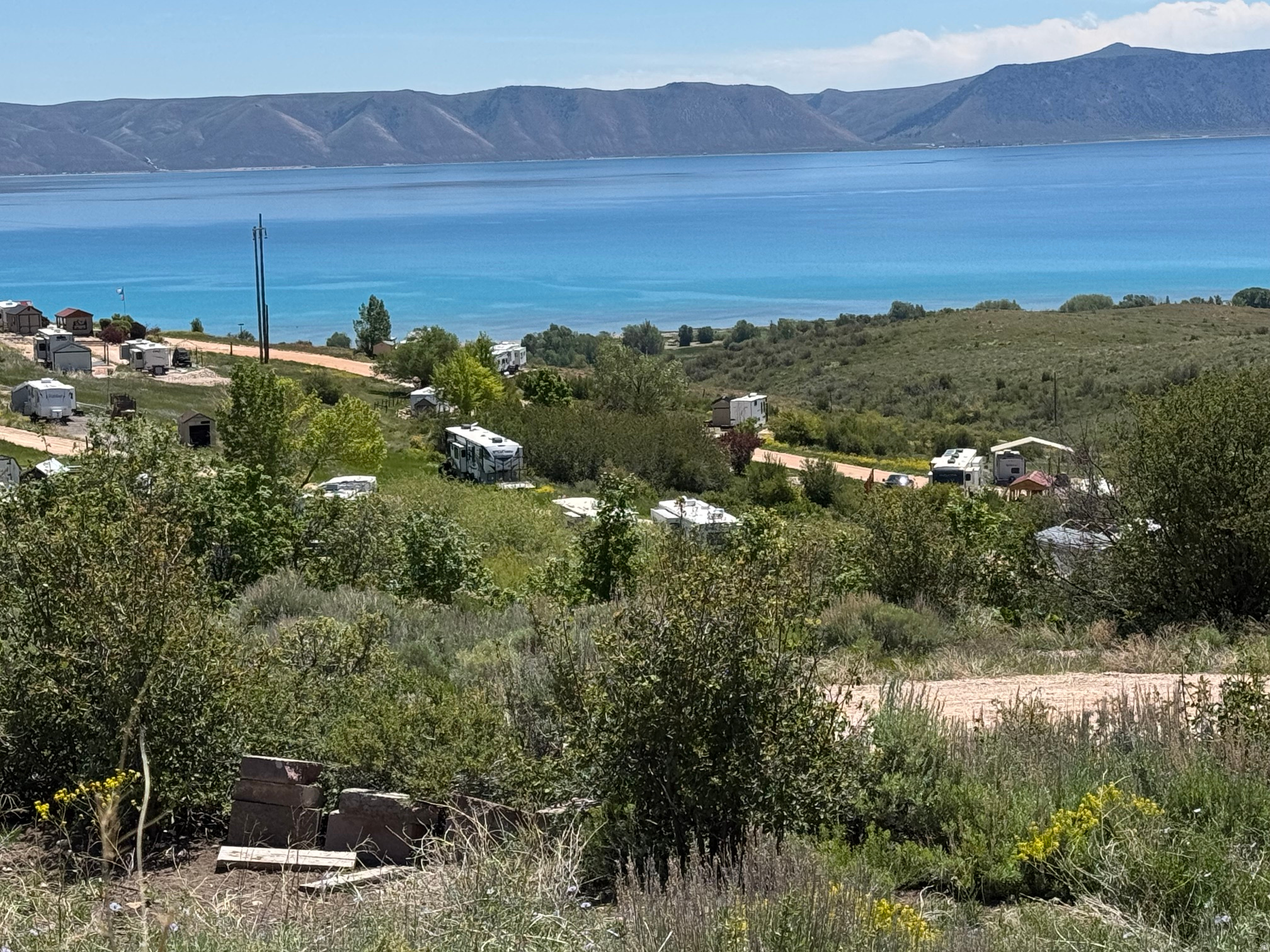 Lot 77 is one of the nicest lots in Bear Lake RV Park.  Located at the end of Buttercup Circle backed on the north and east by a huge common area, with spectacular VIEWS of Bear Lake and trees.  There is power at back of lot, water line is in the road ready for Buyer to bring into lot.  Sewer is a dump-station at Park entrance. Make this your BEAR LAKE summer get-away!  Contact listing agent for details. No Short-Term-Rentals.