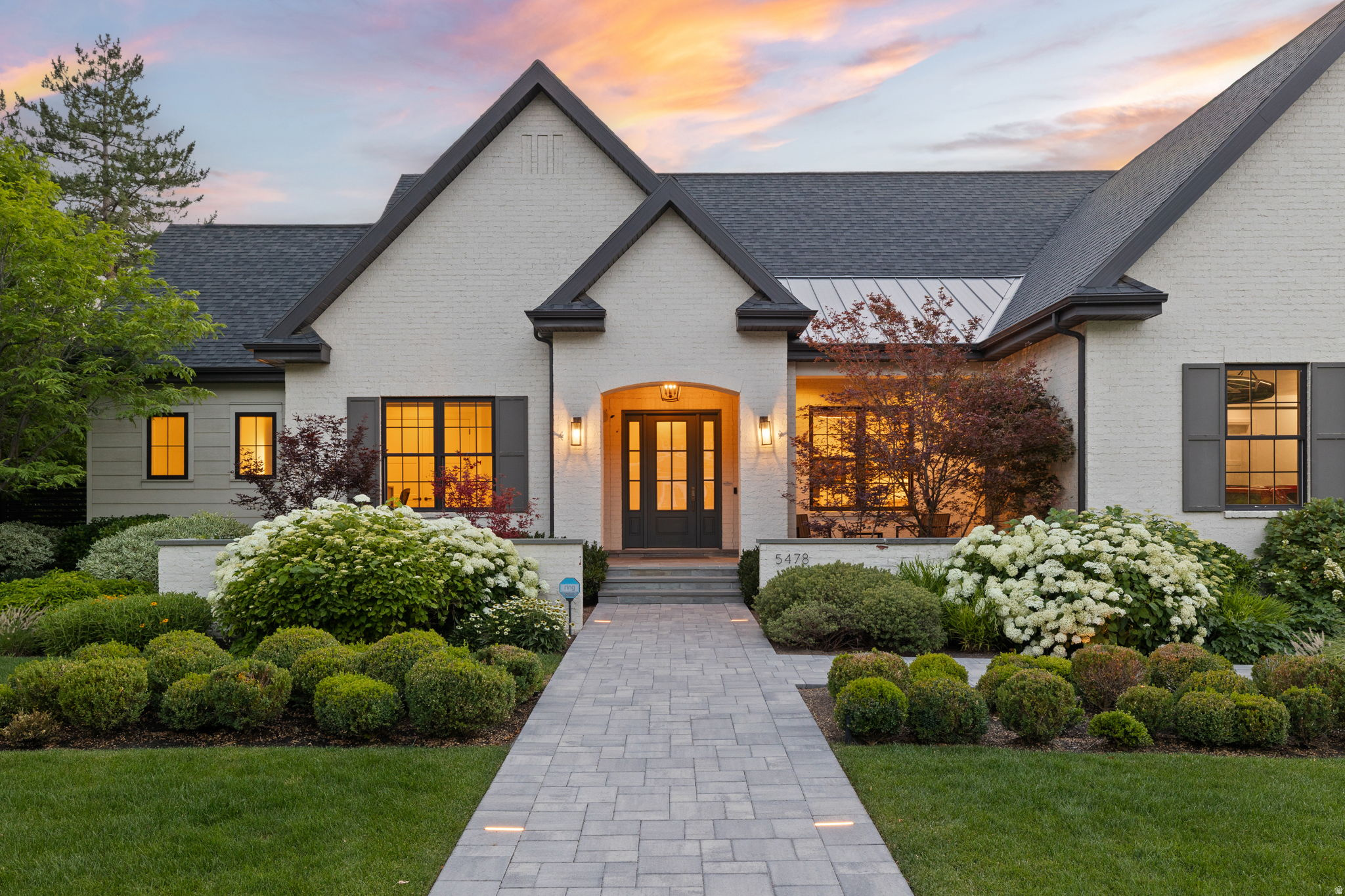 Truly Extraordinary Cottonwood Club Rambler on a masterfully designed and landscaped half acre! Extensive remodel completed in 2024. The quality of materials, finishes, systems, and level of craftsmanship were the focus and no expense was spared. The result is beautiful, and warm, sunlit spaces where life flows effortlessly from inside and out. Daylight and garden views fill the lower level which now includes a gym and new bathroom. Solid white oak flooring throughout main and lower level. Imported tile and stone countertops in kitchen and bathrooms. All bathroom floors are HEATED! NEW paver driveway and walk-way are HEATED. 4 car garage is heated and cooled!  This is an extremely rare property in a highly coveted neighborhood!