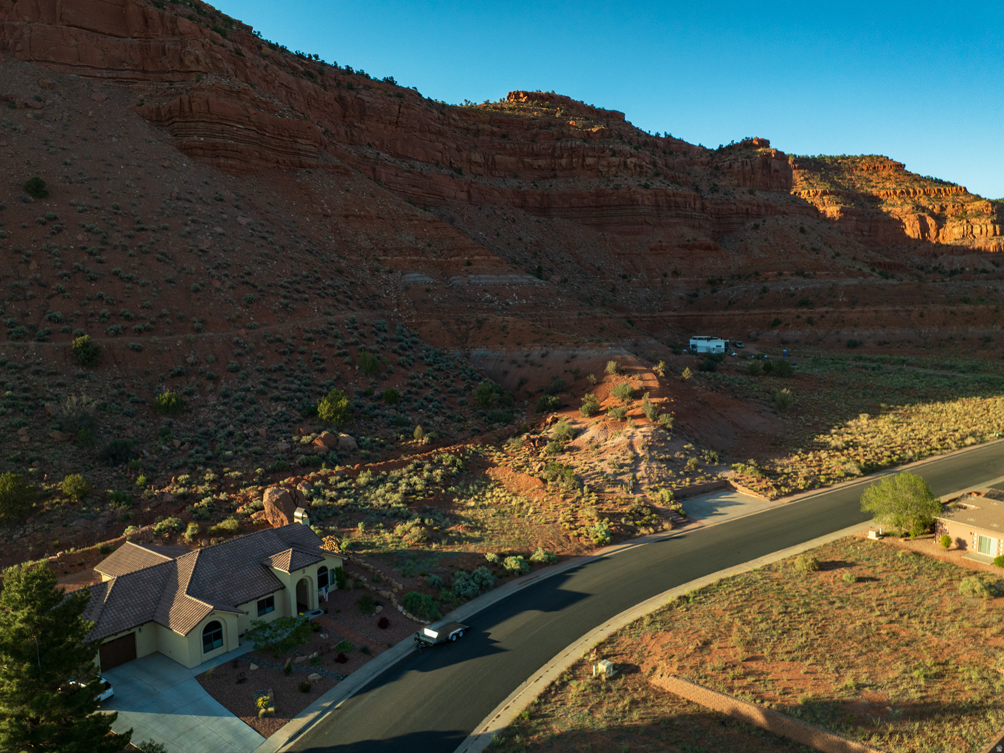 Build your dream escape on this .32-acre homesite inThe Cove at Coral Cliffs, perfectly positioned for breathtaking cascading red-rock views. The south-facing orientation is ideal for passive-solar home design, offering year-round efficiency and natural light. Located in town yet surrounded by adventure, this lot sits adjacent to the popular K-Hill Trail, giving you instant access to one of Kanab's favorite hikes. You're also just a short drive from Zion National Park, Bryce Canyon, the North Rim of the Grand Canyon, and Lake Powell. Enjoy the best of Kanab, including a front-row seat to the annual Balloons & Tunes Festival-watch the colorful hot-air balloons rise right from your own yard. A rare opportunity to live, play, or invest in Southern Utah's most captivating landscape. (Buyer to verify all)